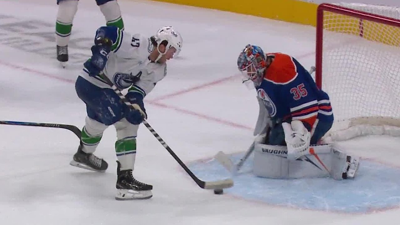 Sasson corrals loose puck and sets up Cotter for Canucks OT winner