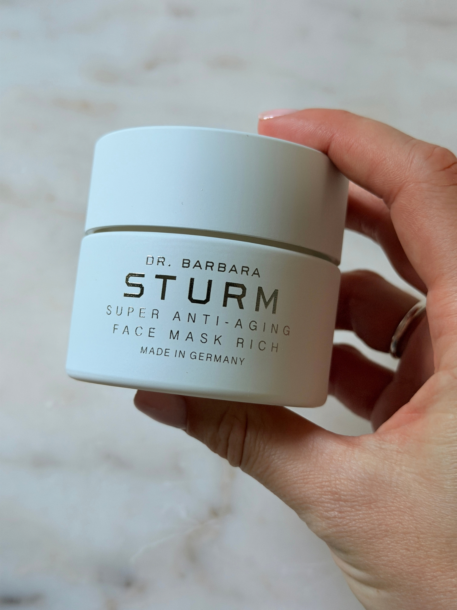 Freelance beauty editor Grace Day holding the Dr. Barbara Sturm mask