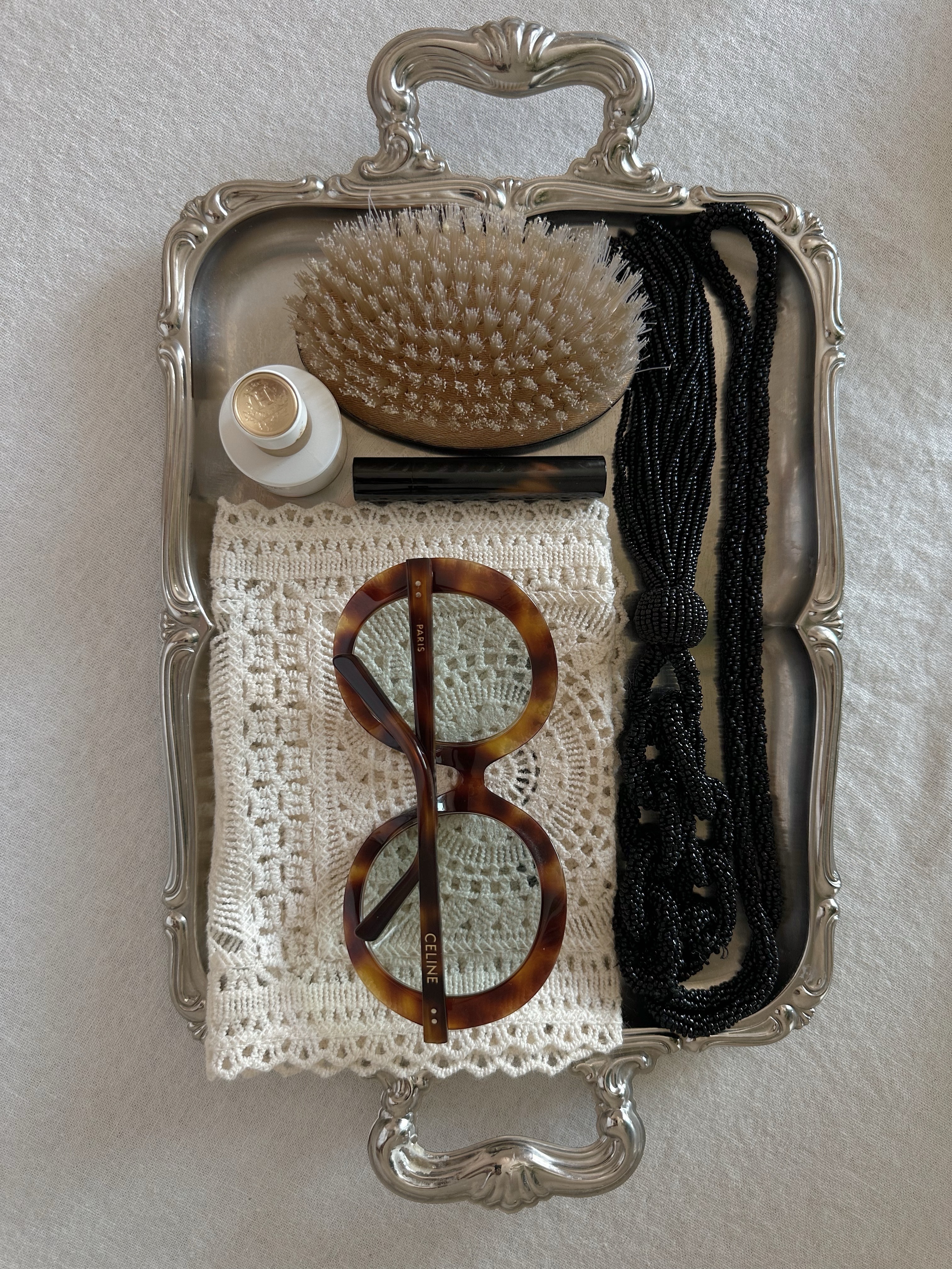 Celine round sunglasses in a metal tray.