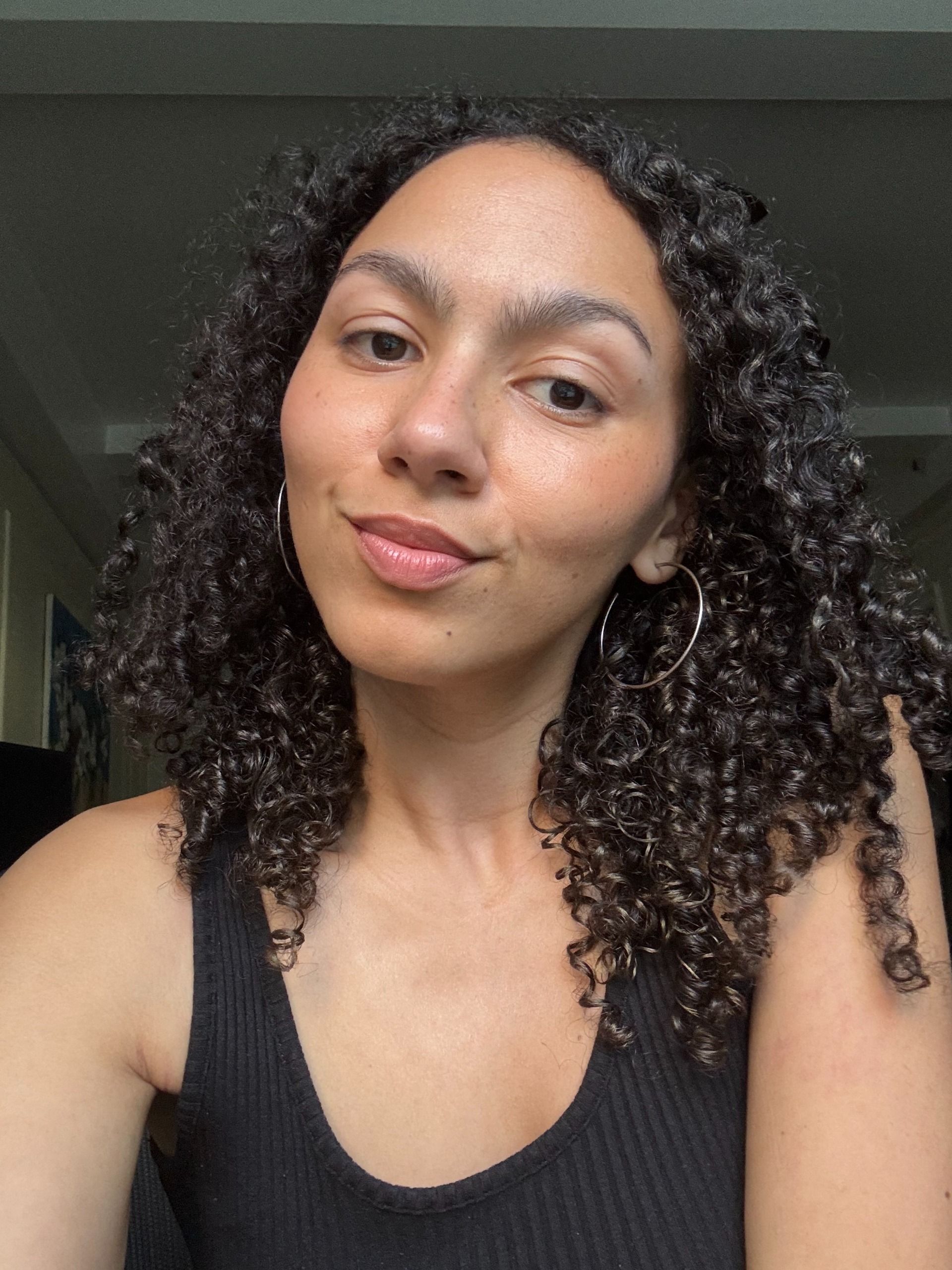 Assistant beauty editor Sabrina Talbert testing the As I Am Curl Color in Bold Gold.