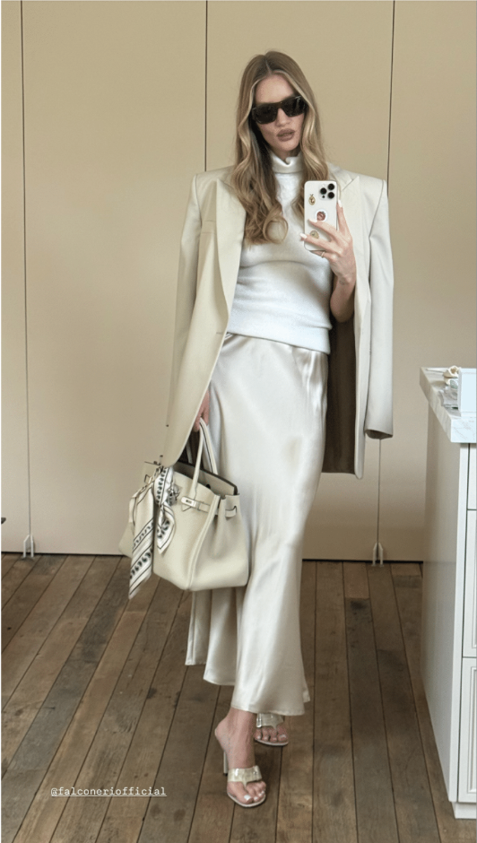 rosie wears a falconeri sweater, skirt, and blazer with a hermes bag.