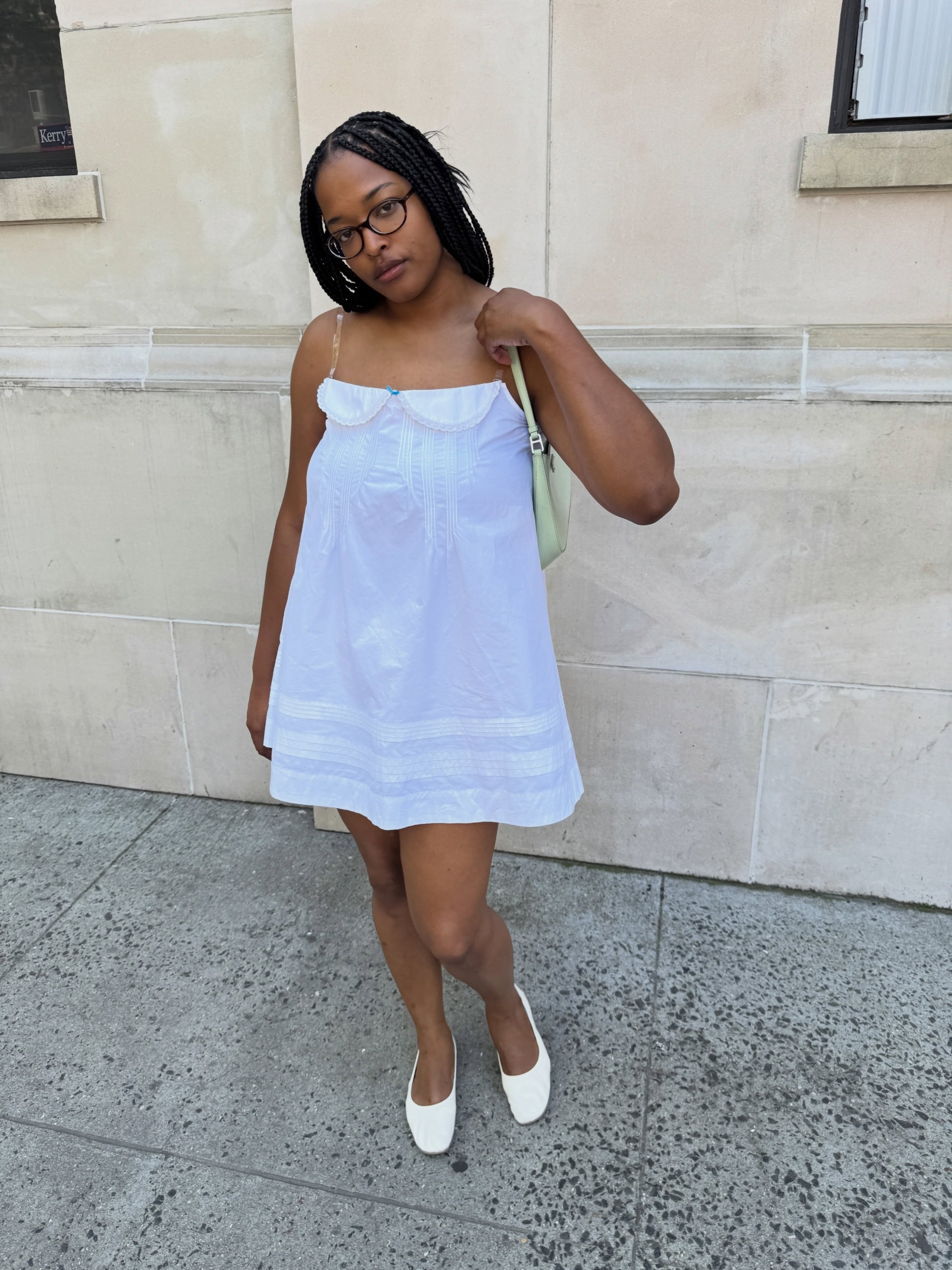 Influencer wearing babydoll dress.