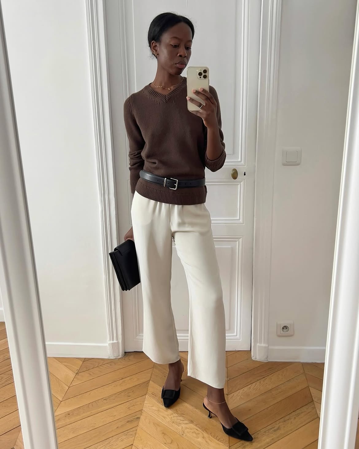 Sylvie wearing brown jumper