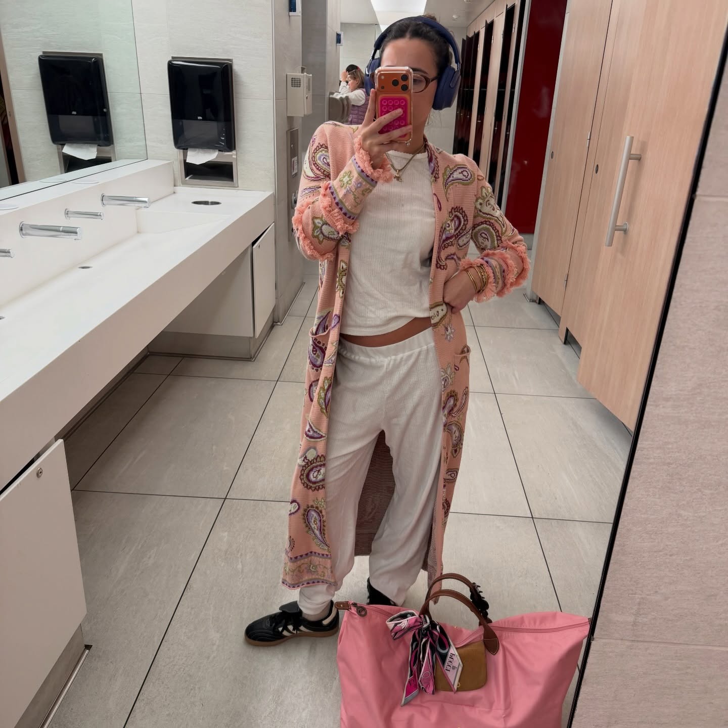 Woman wearing a business-class travel outfit.