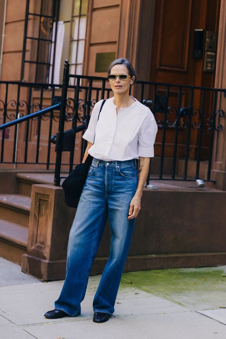 Woman in NYFW street style denim outfit.