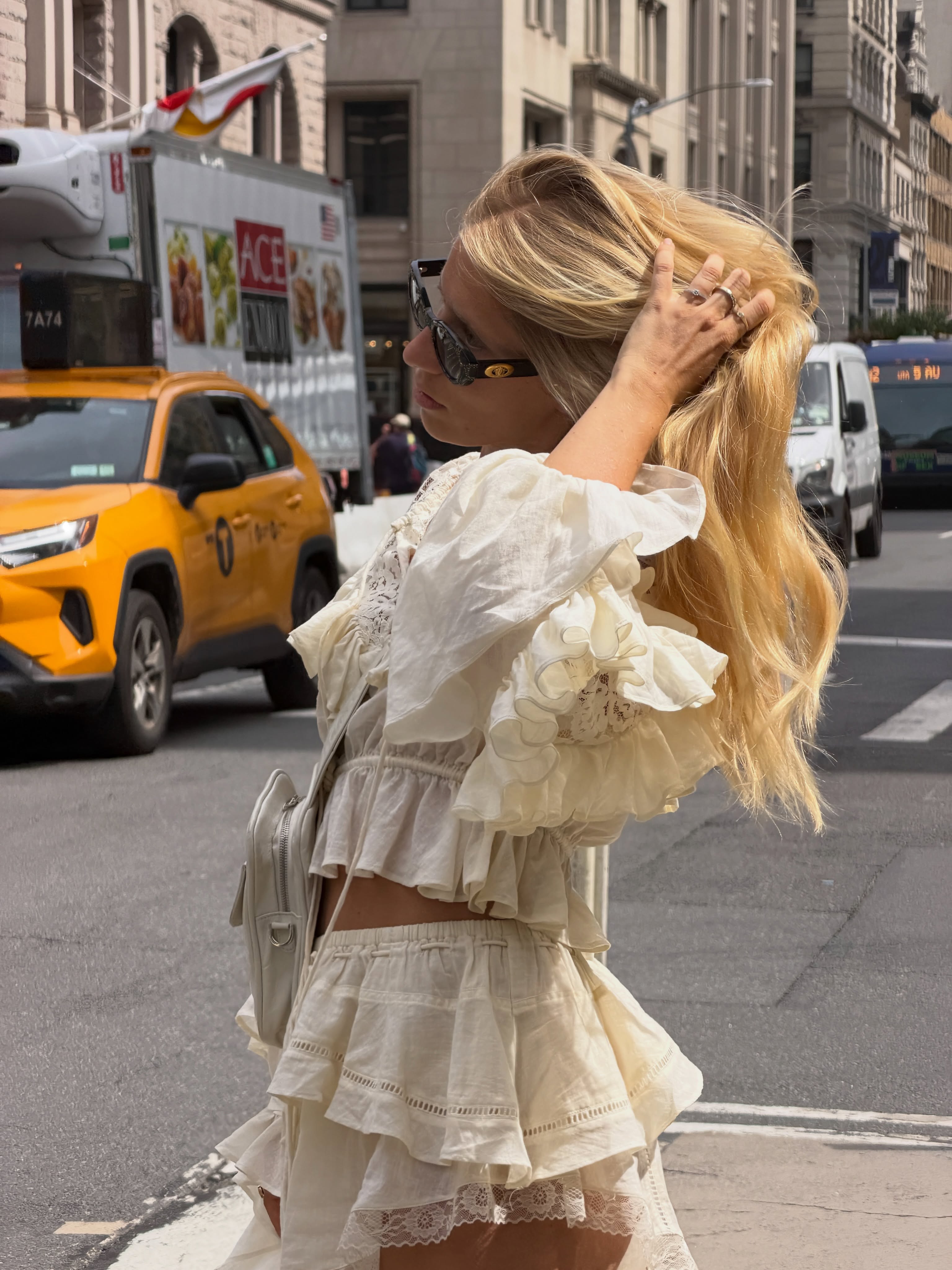 A woman with blonde, shiny hair in NYC.