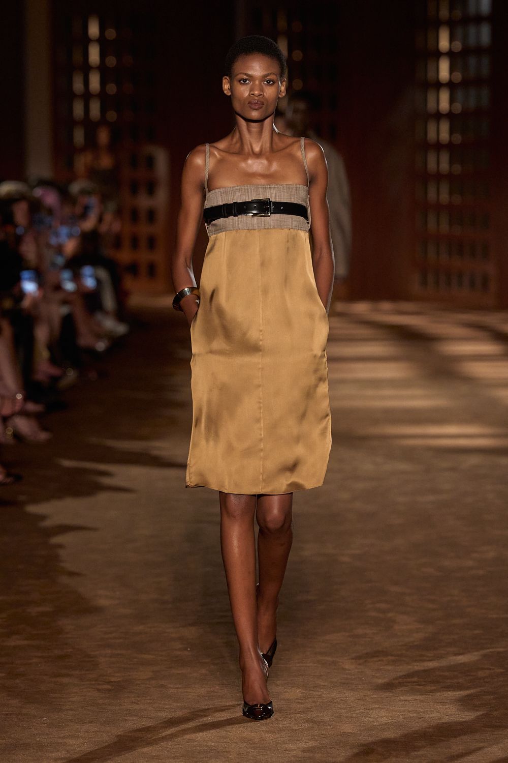 a model walks the ferragamo spring 2027 runway.
