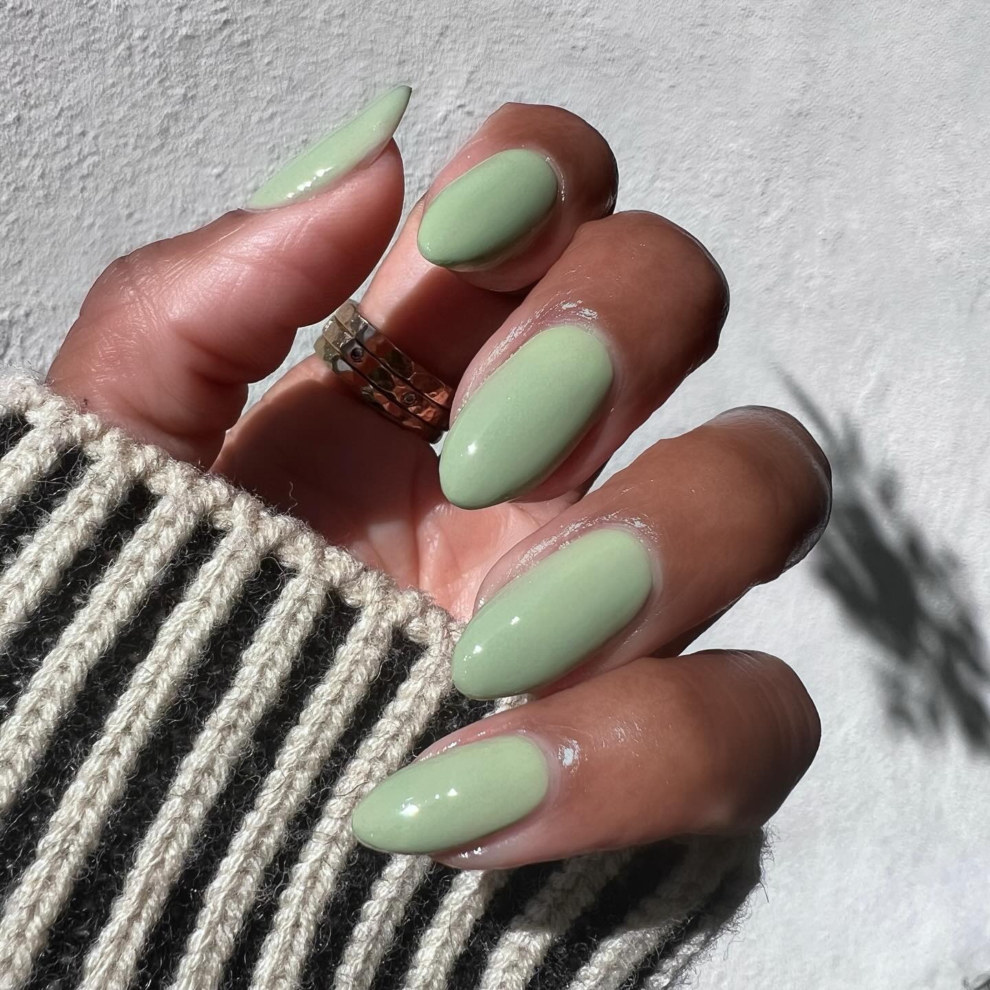 A milky green manicure