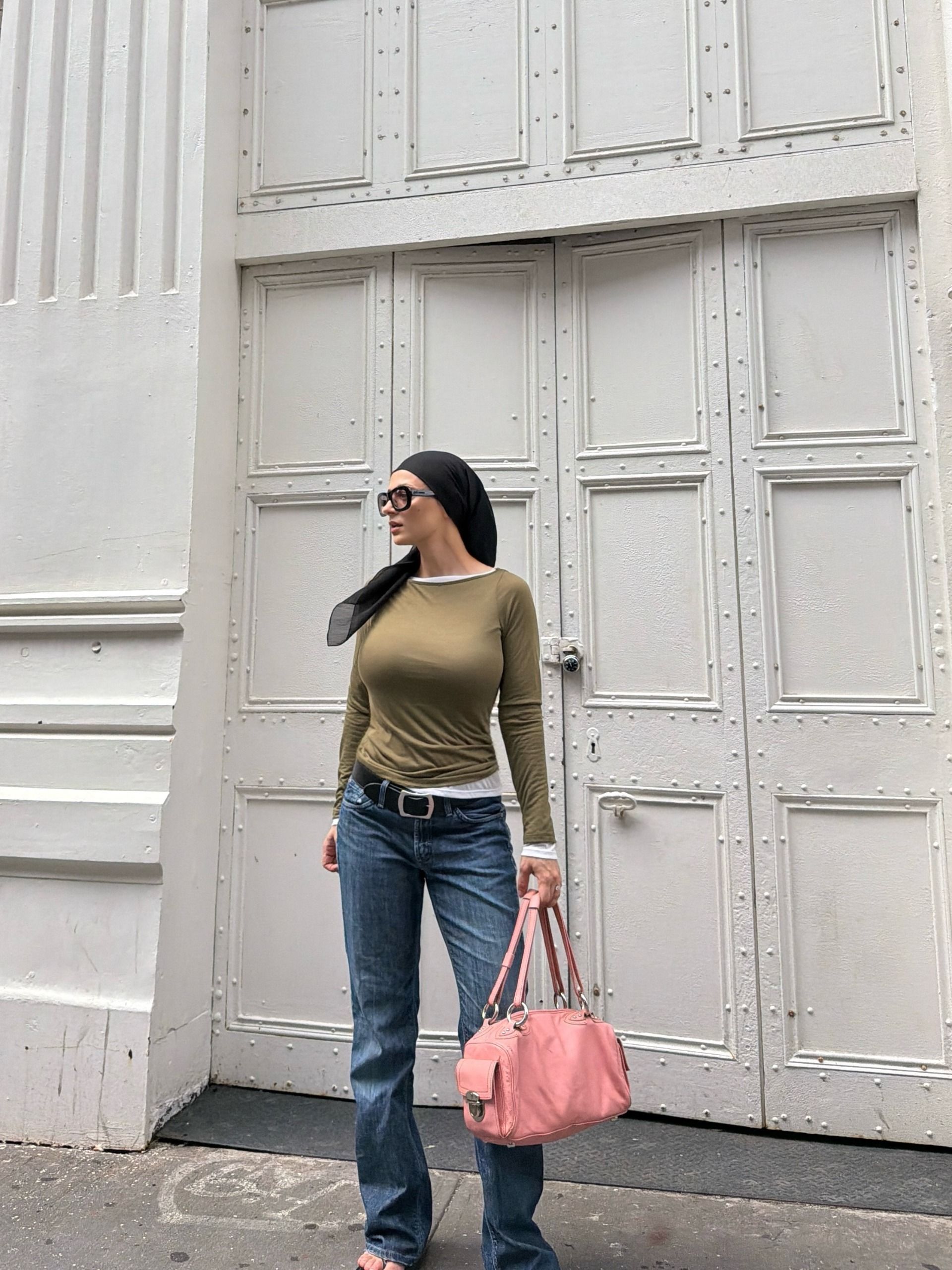 A woman wearing low rise bootcut jeans in 2026.