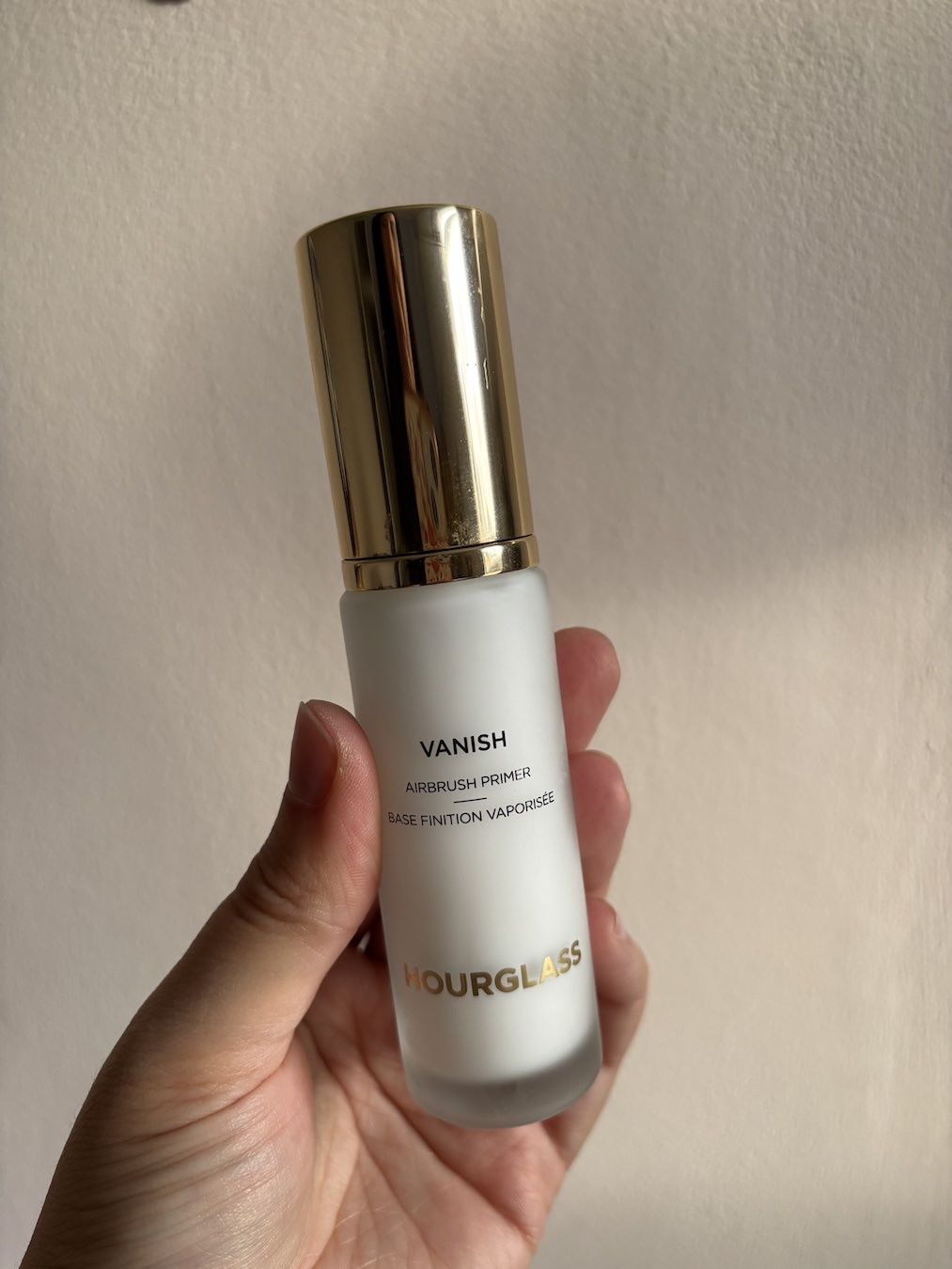 Mica Ricketts holding Hourglass Vanish Airbrush Primer
