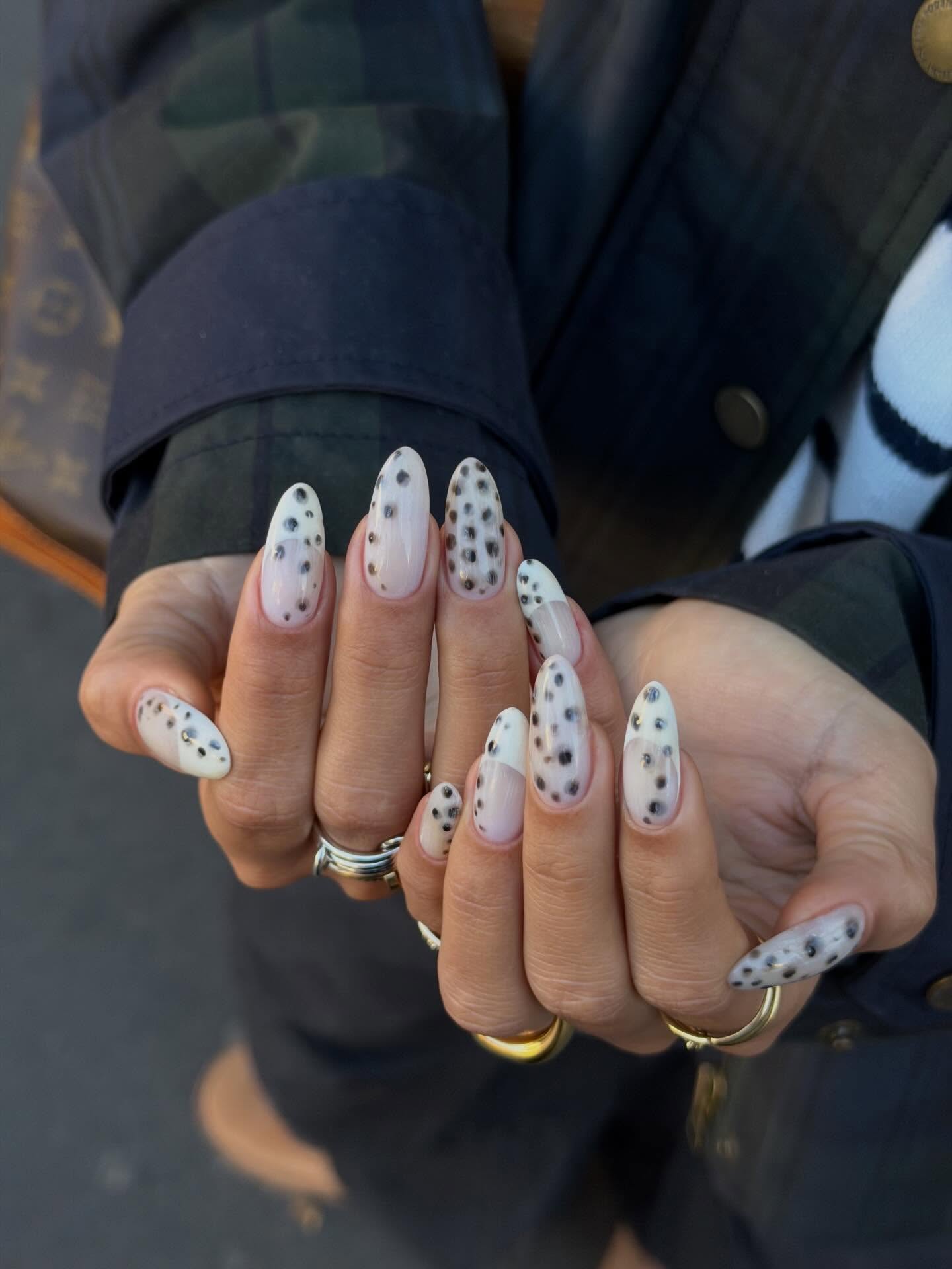 Dalmation-print manicure on milky base