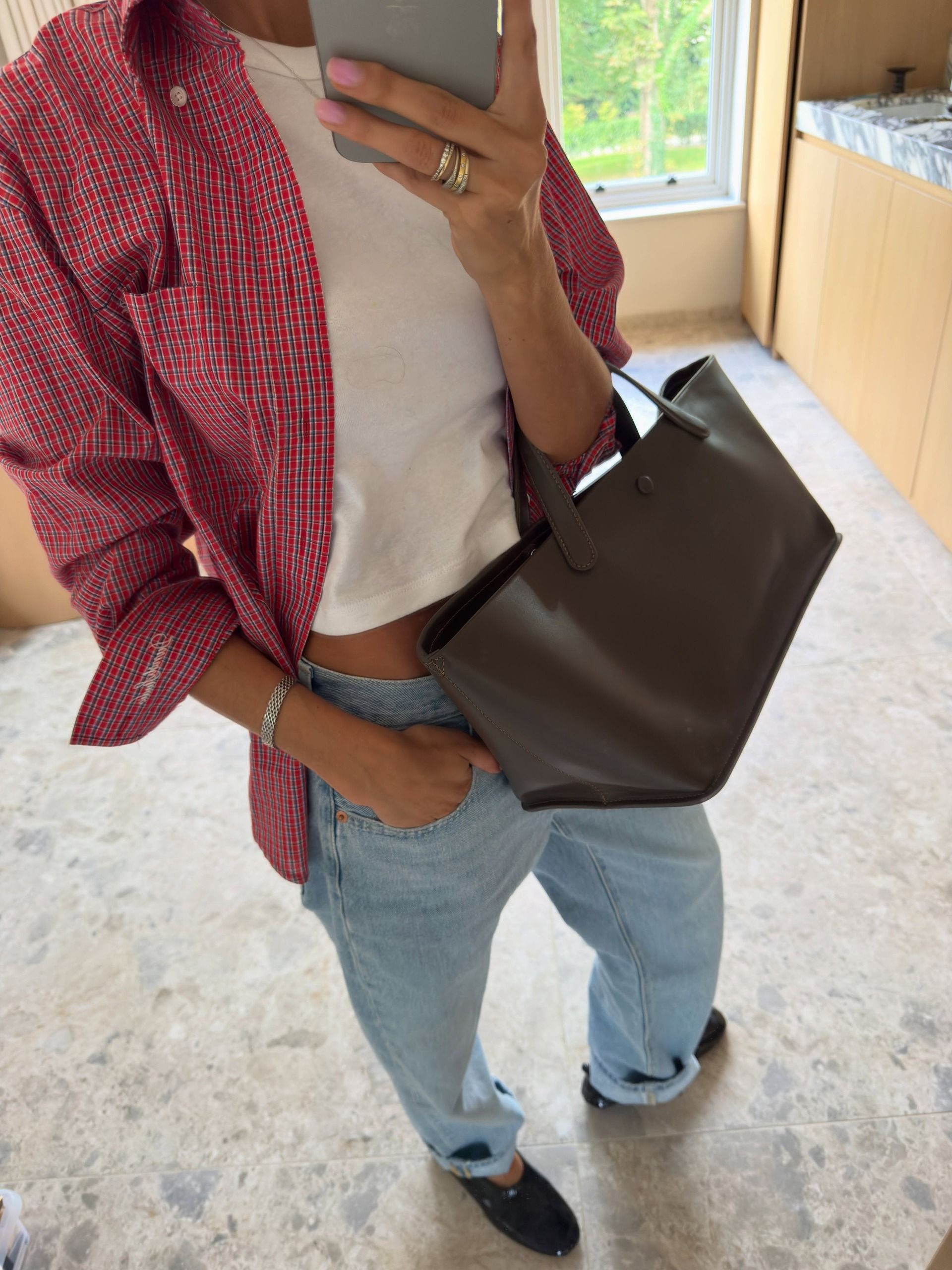 An image of a woman wearing put together fall outfit formula 2026