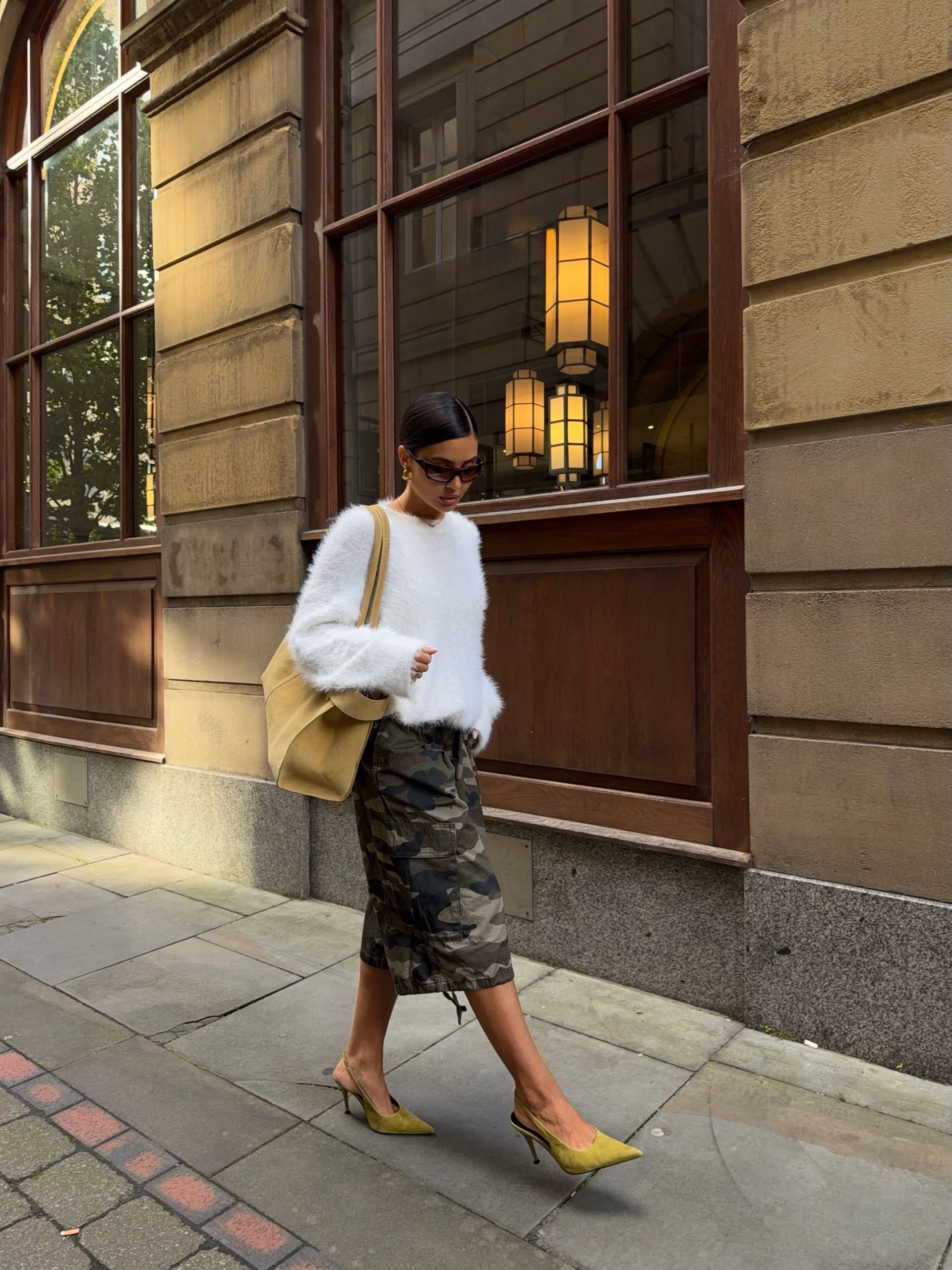 A woman wearing a fall sweater outfit in 2026.