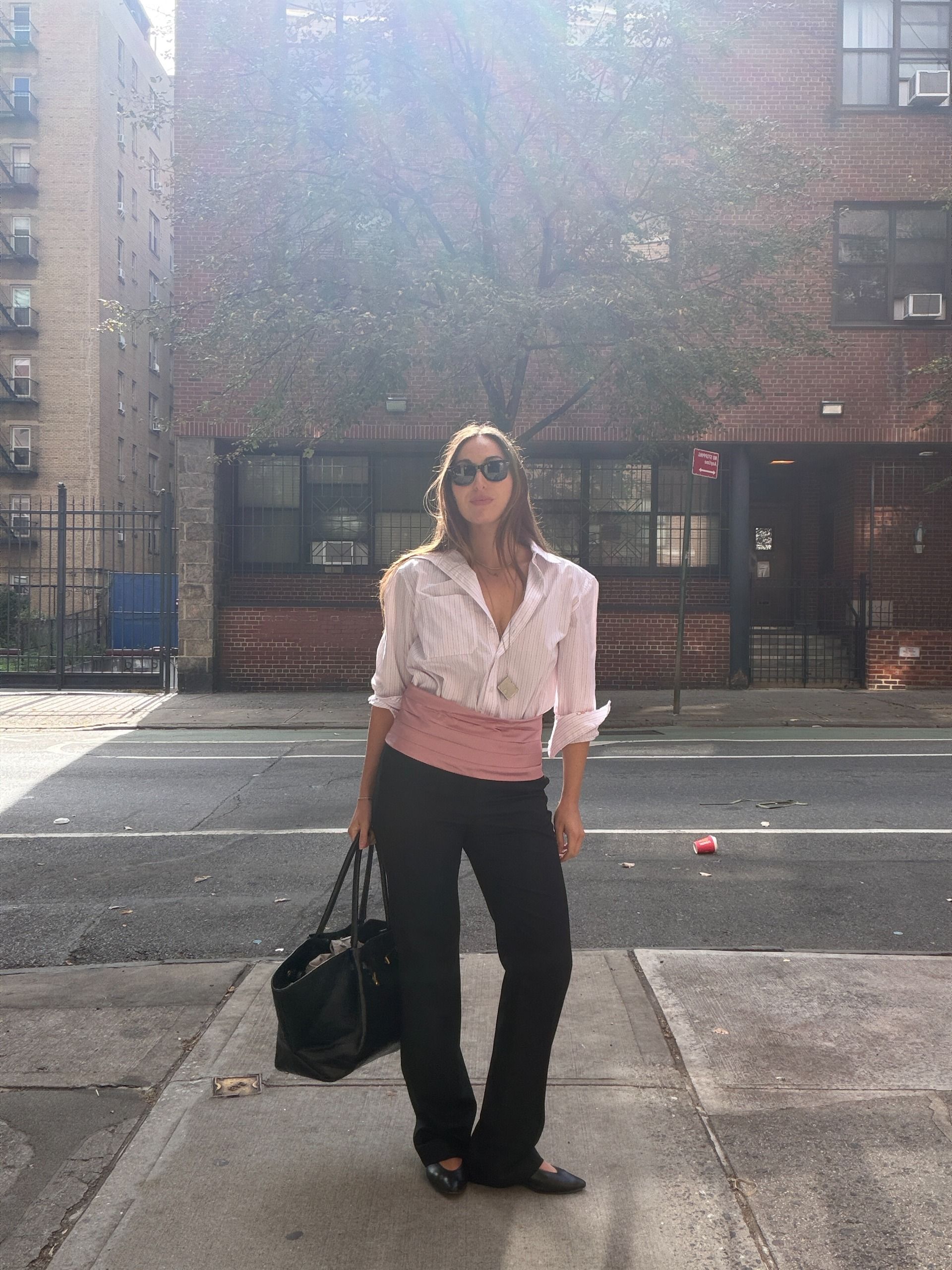 an outfit photo of senior fashion editor Anna LaPlaca wearing the cummerbund trend for fall 2026