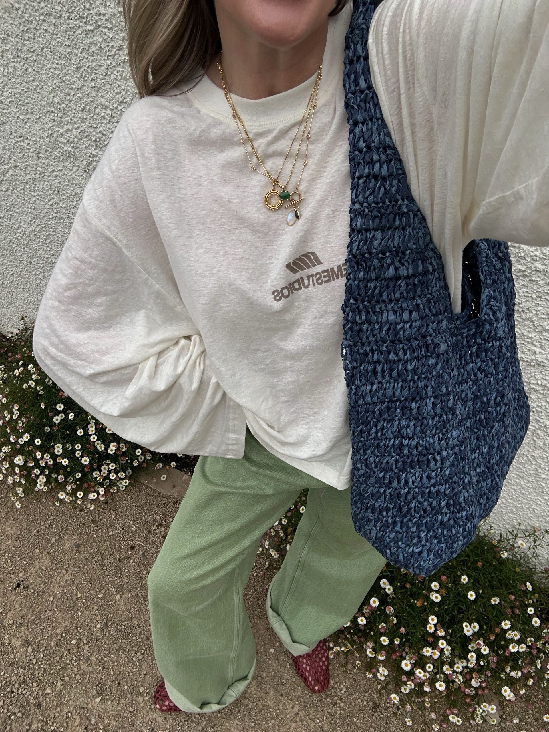 An image of a woman wearing green denim outfit fall 2026