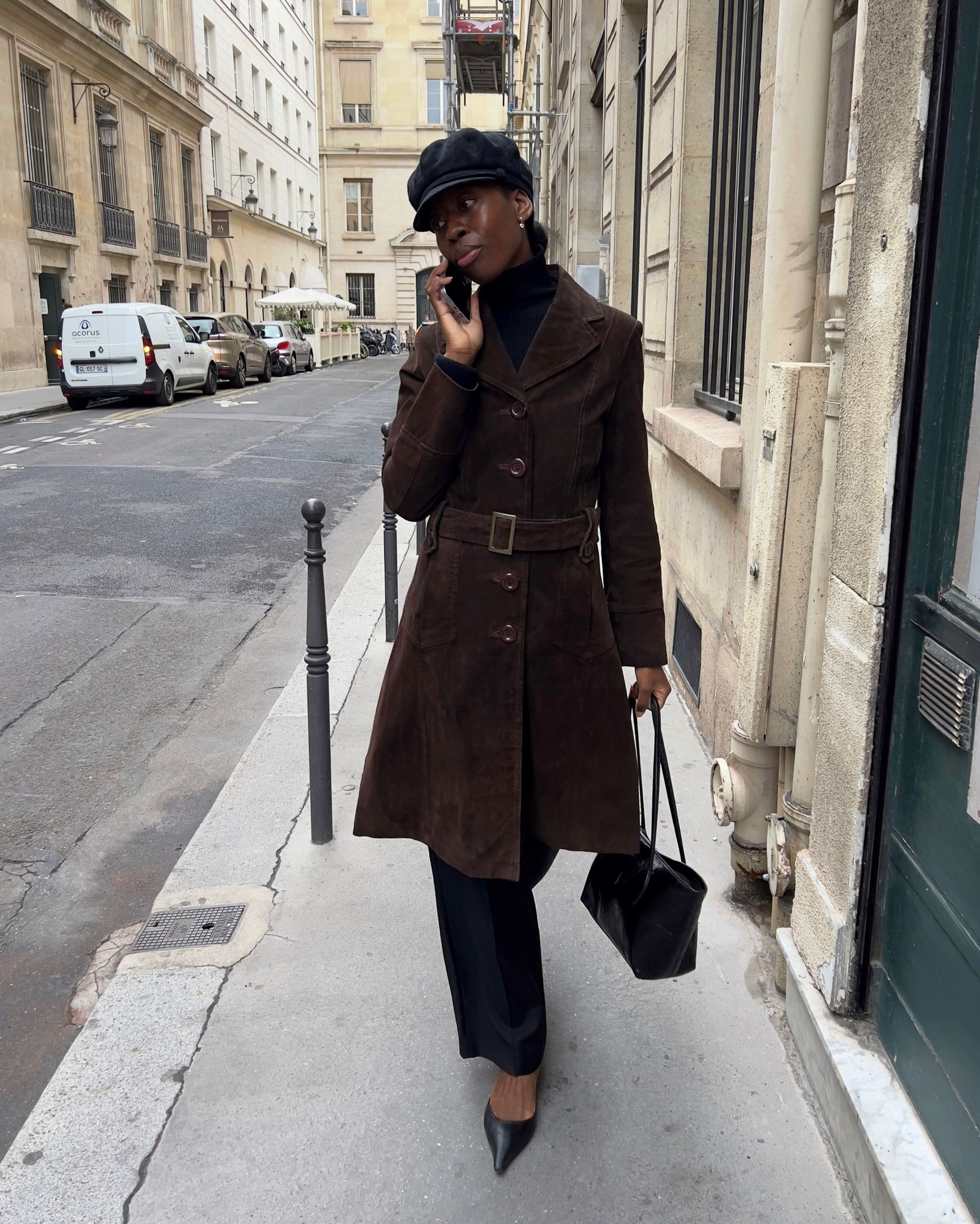 An image of @sylviemus_ wearing pointed-toe heels with a suede jacket.