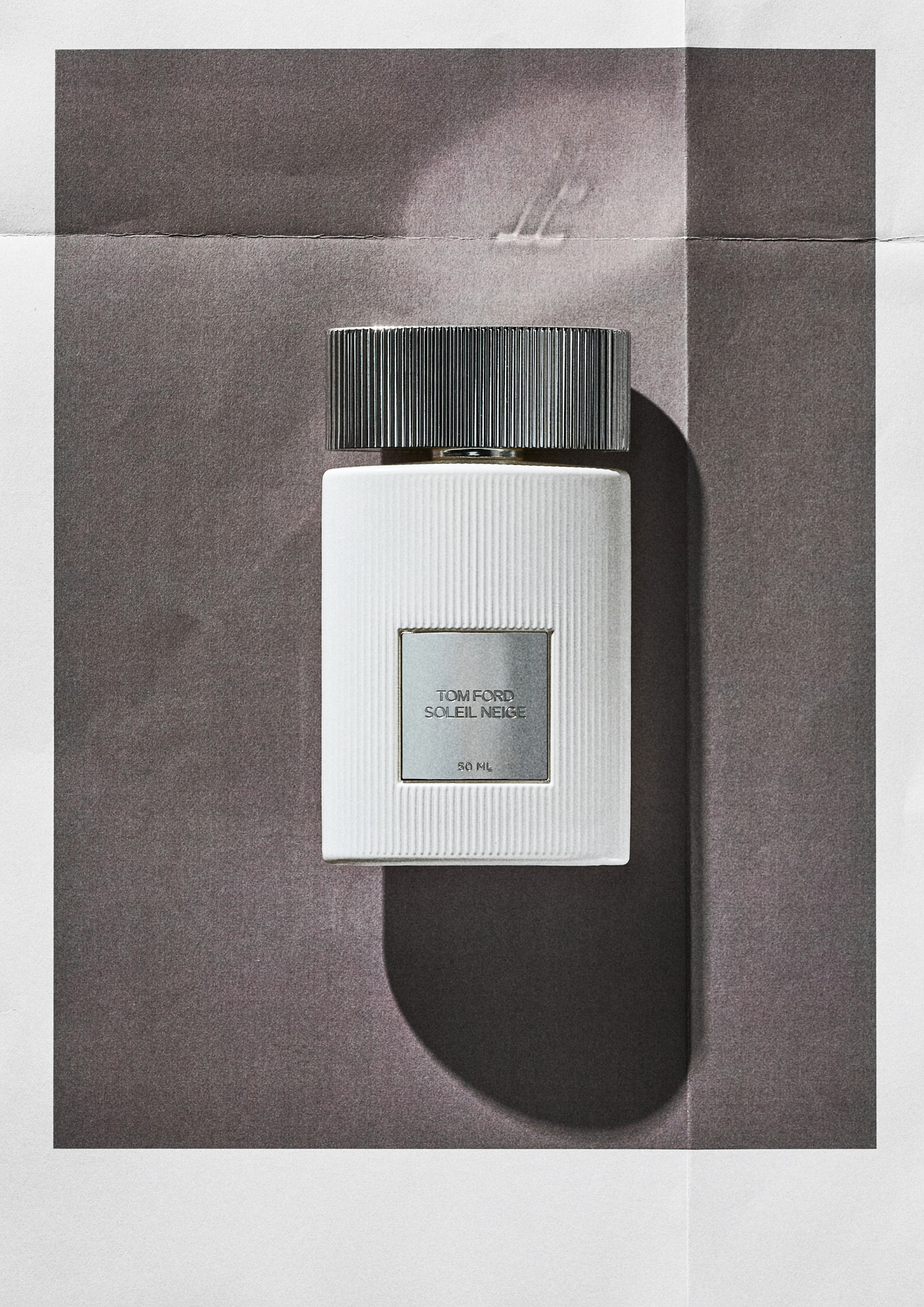 Tom Ford Soleil Neige on a grey background