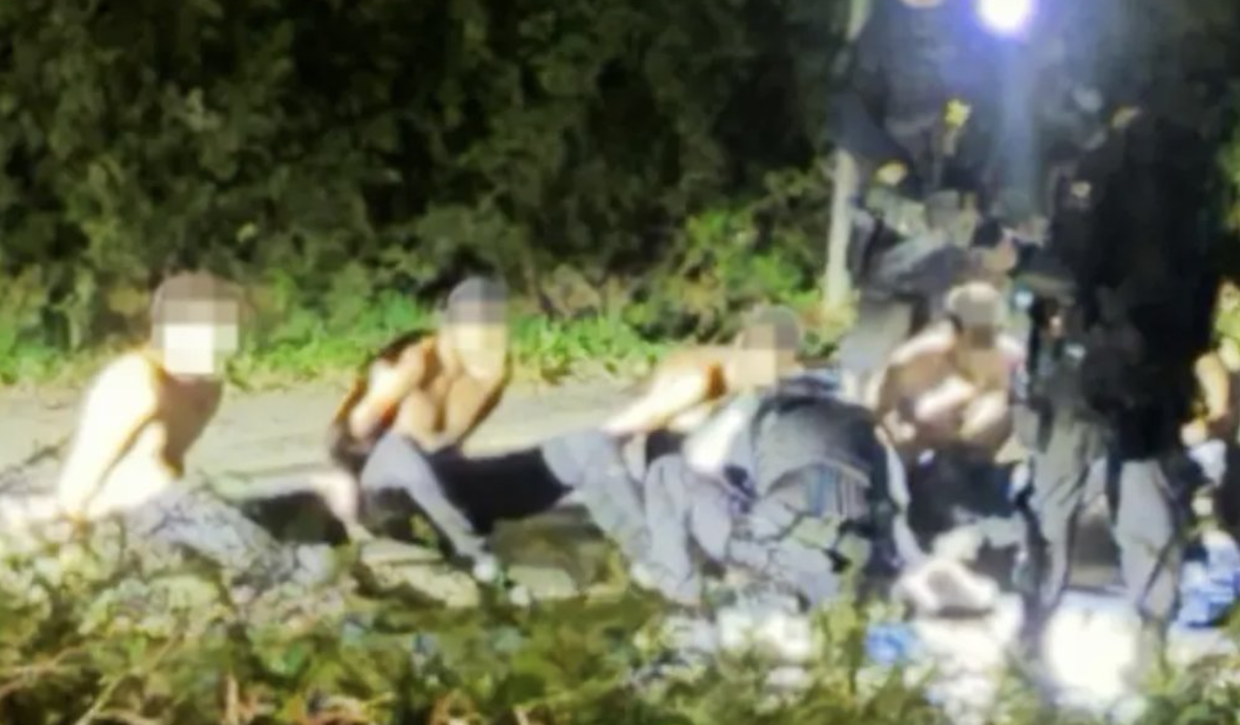 A group of men arrested near RAF Fairford, England, September 27, 2026
