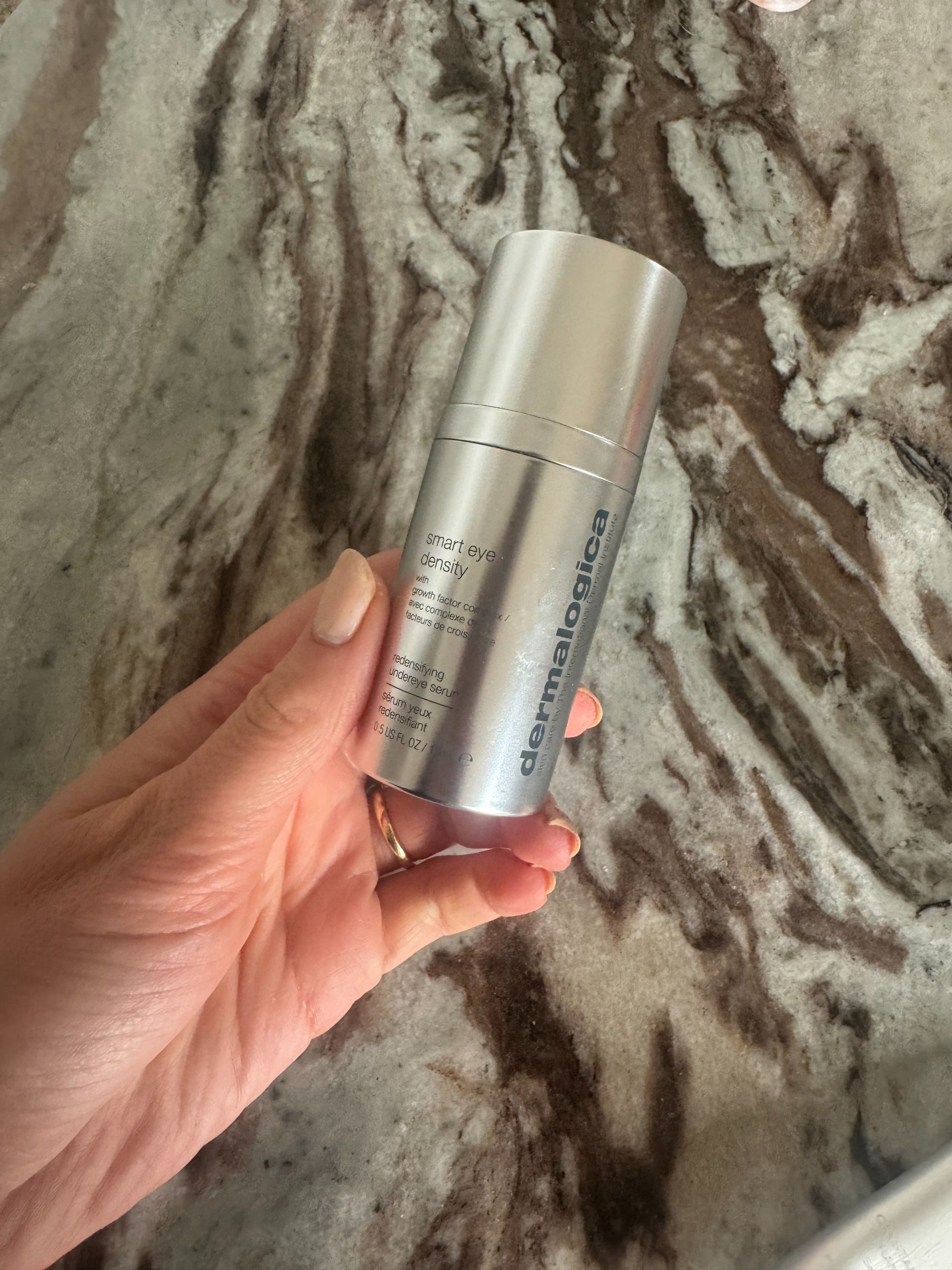Eleanor holding the Dermalogica Smart Eye Density eye cream