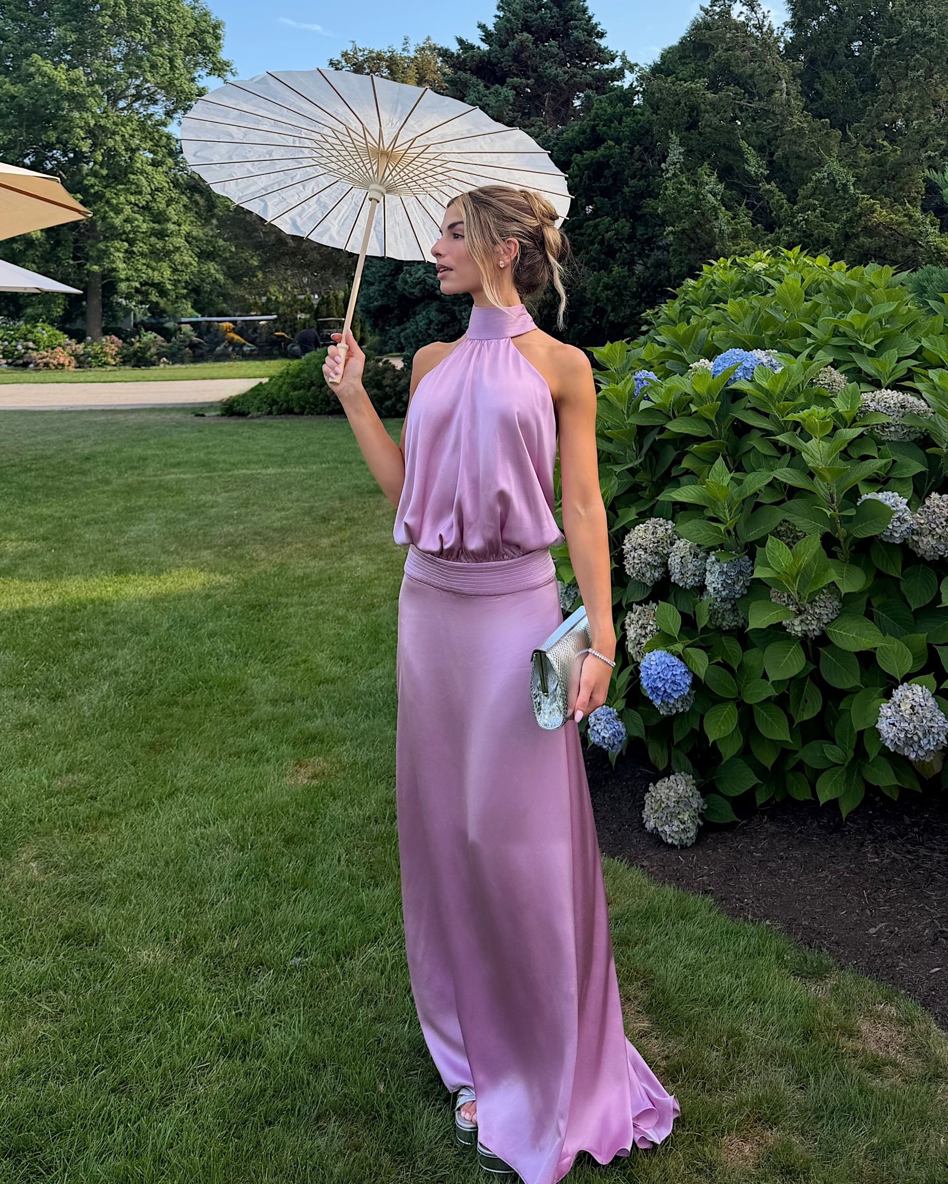 A long purple dress on Kit Keenan at a wedding.