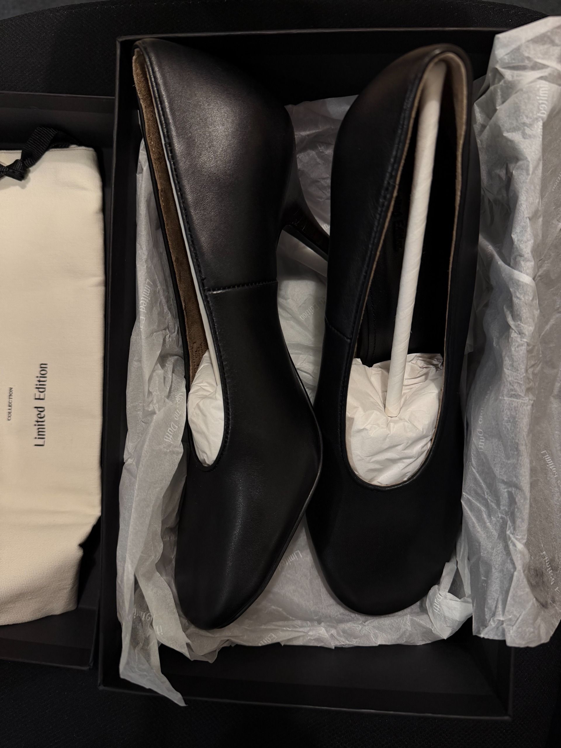a pair of black round-toe pumps from Massimo Dutti