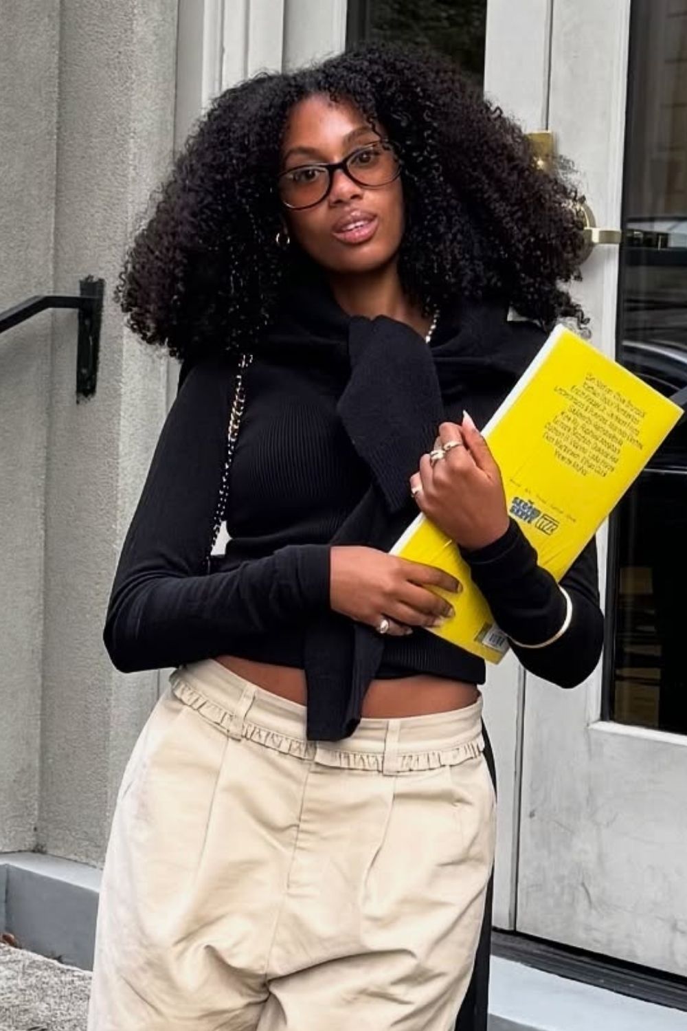 a close-up shot of an afro hairstyle worn with glasses