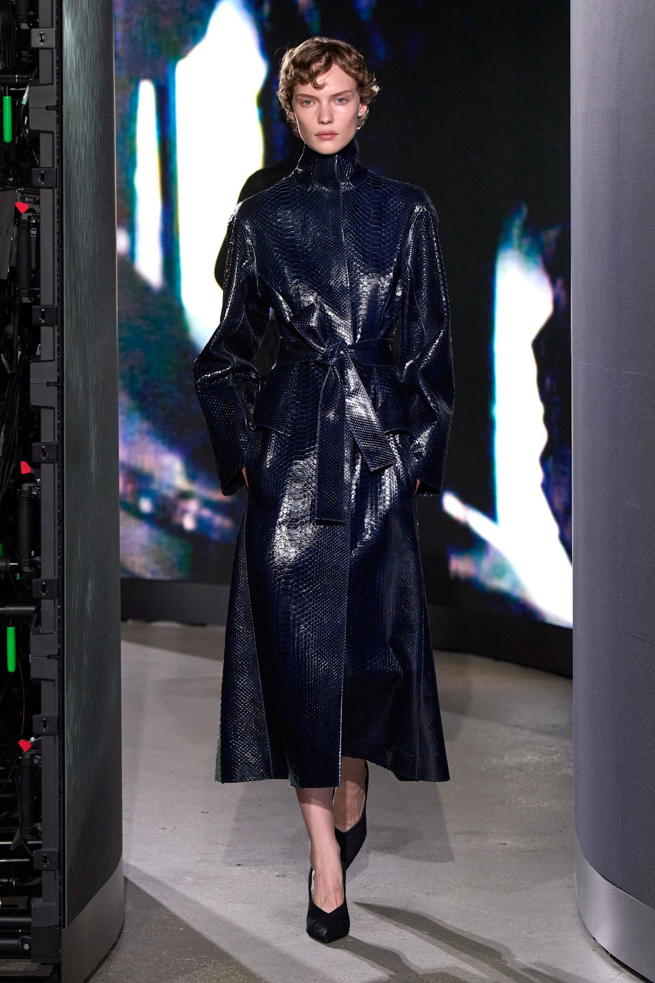 A model walking in the spring/summer 2027 Alaïa show during Paris Fashion Week wearing a jewel-tone look.