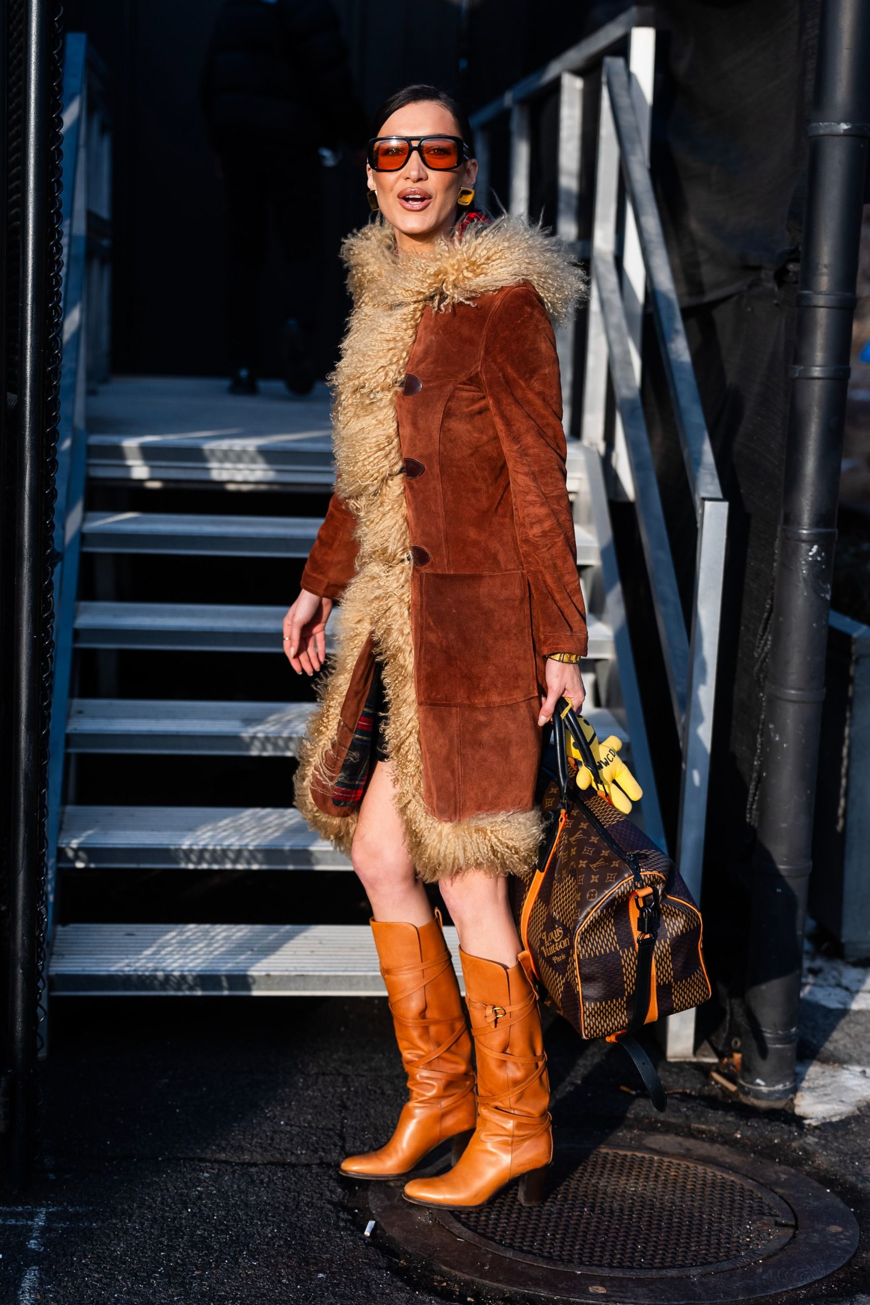 Penny Lane coat trend 2026: Story image.  Bella wears the Penny Lane Coat trend. These images were taken from Getty.
