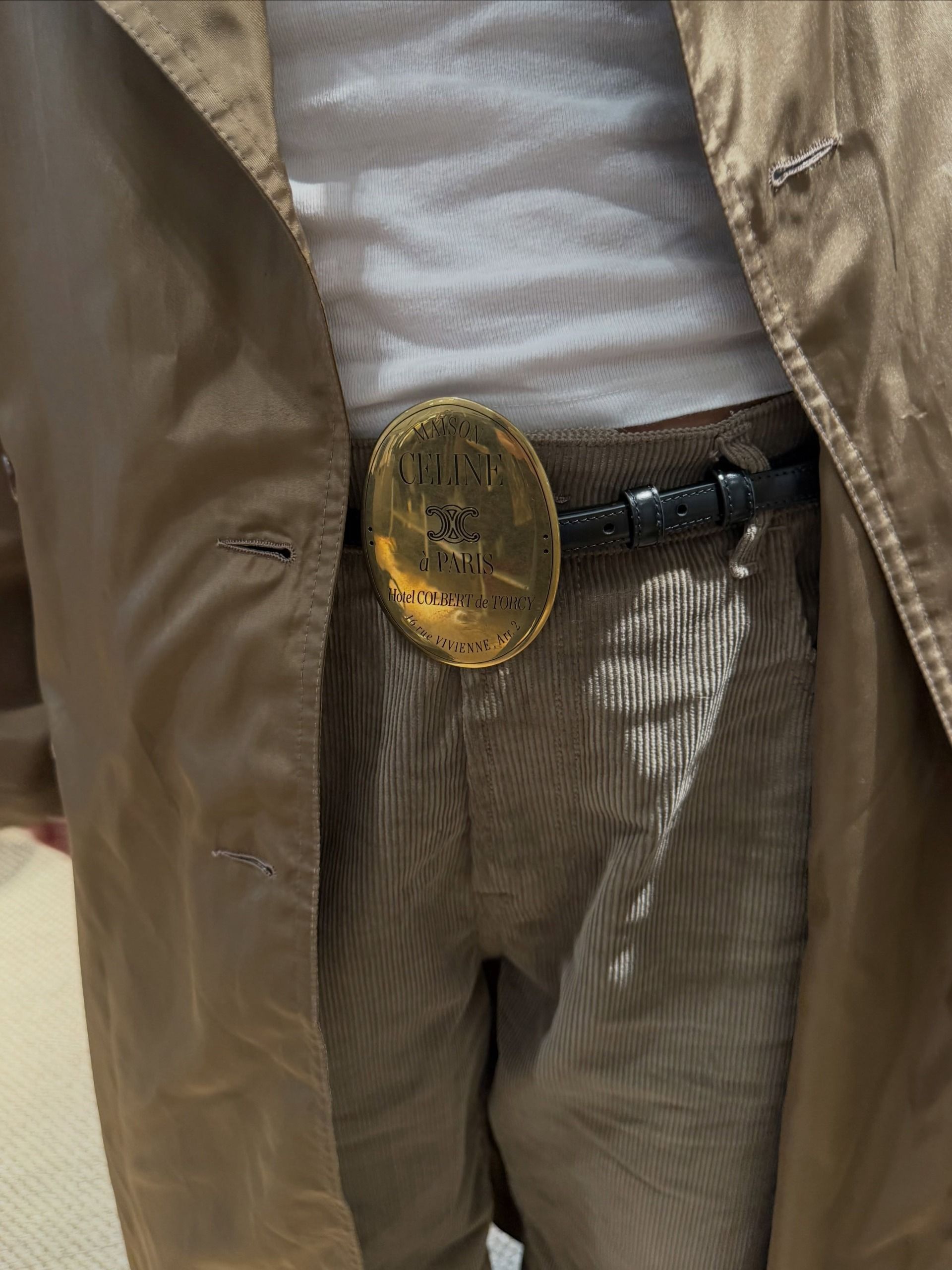 An image of @josefinehj wearing a Celine medallion belt with cord jeans.