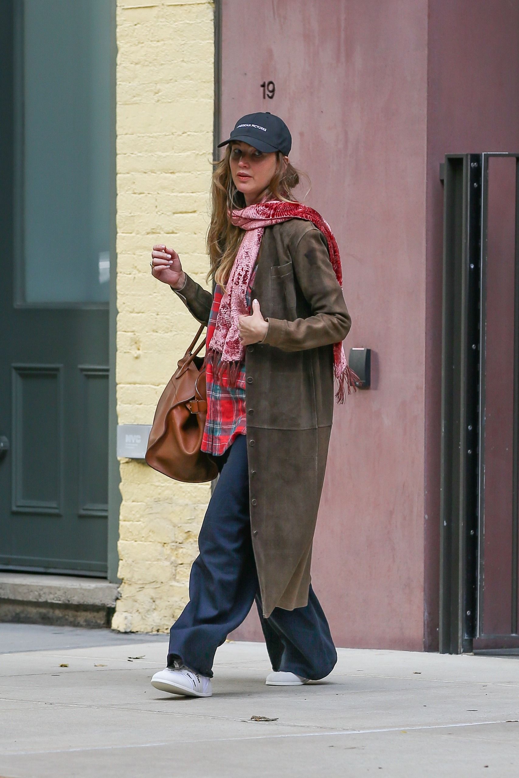 Jennifer Lawrence in a suede jacket and pants