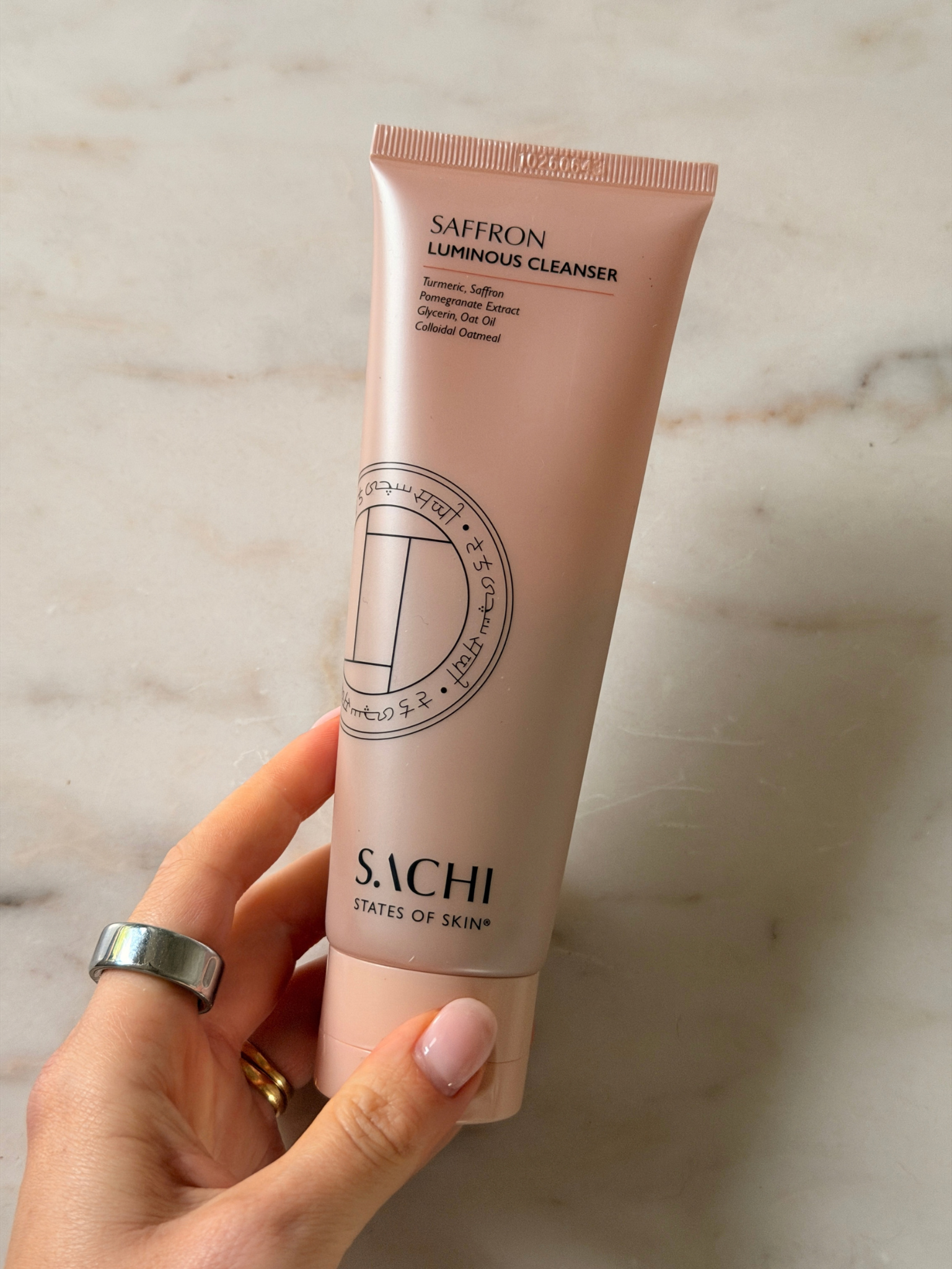 Freelance beauty editor Grace Day holding a tube of