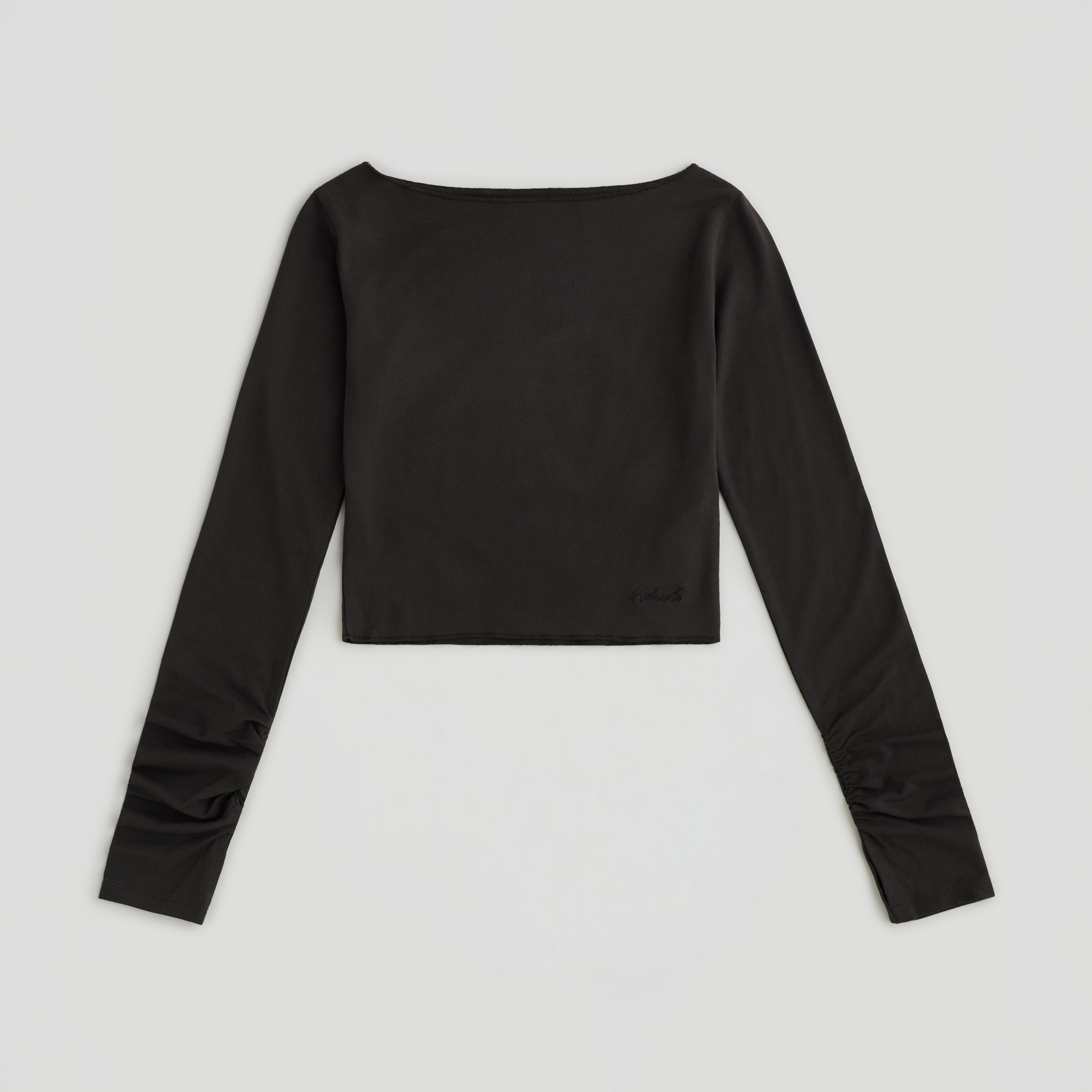 An image of the Adanola x Hailey Bieber slash neck top.