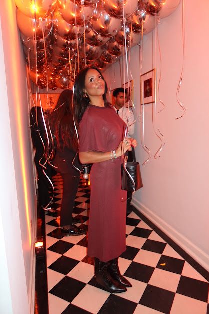 Sierra Mayhew wearing a croc-embossed handbag.