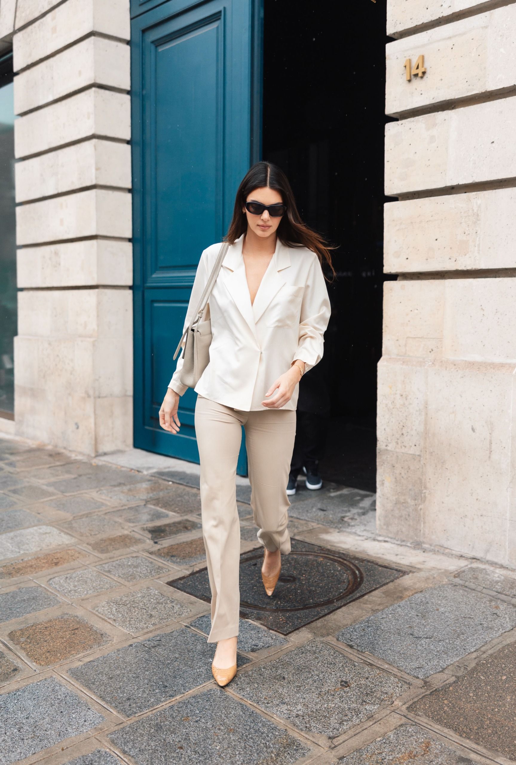 Kendall Jenner in a cream blazer and beige pants