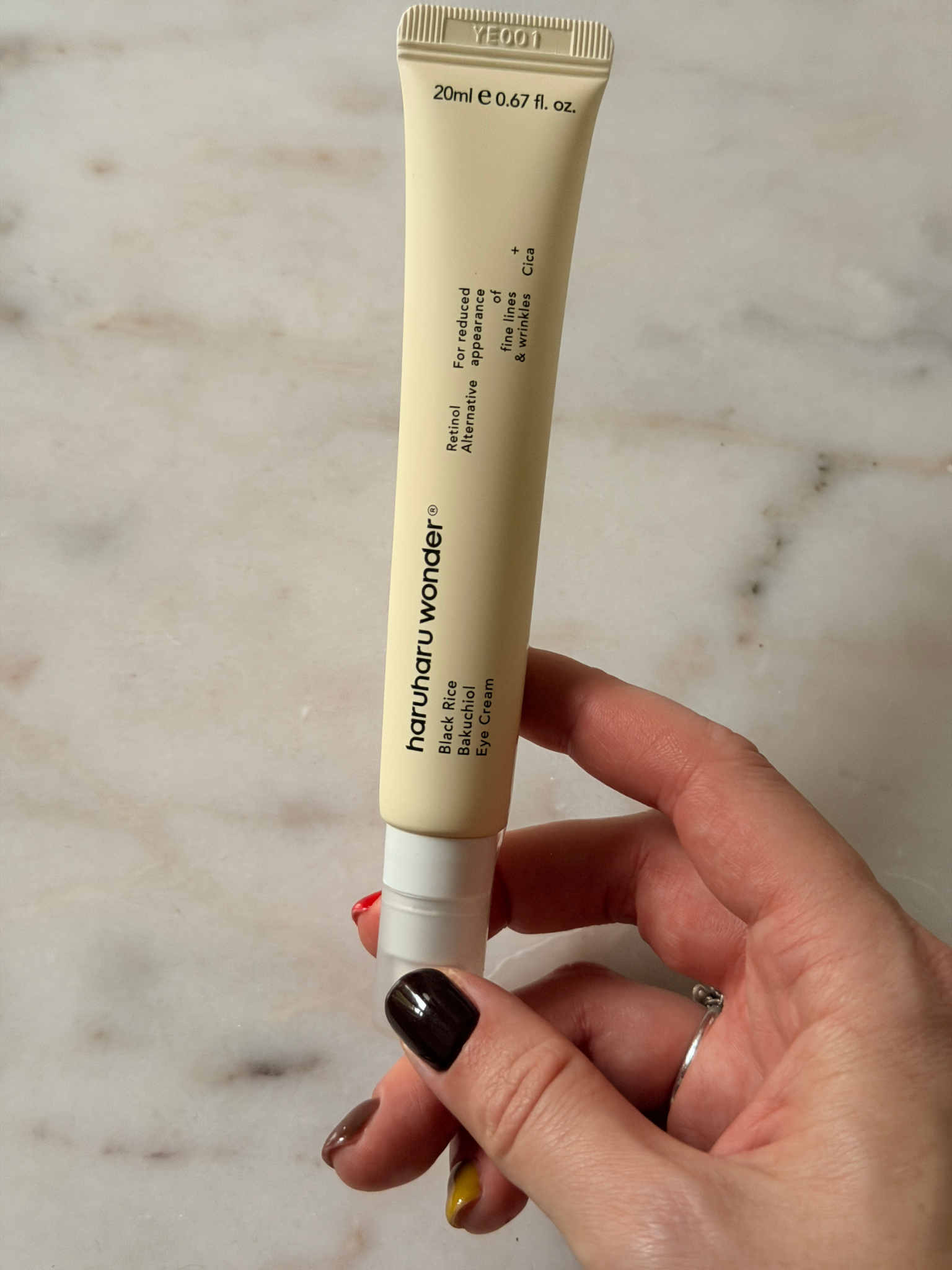 Freelance beauty editor Grace Day holding the Haruharu Wonder eye cream