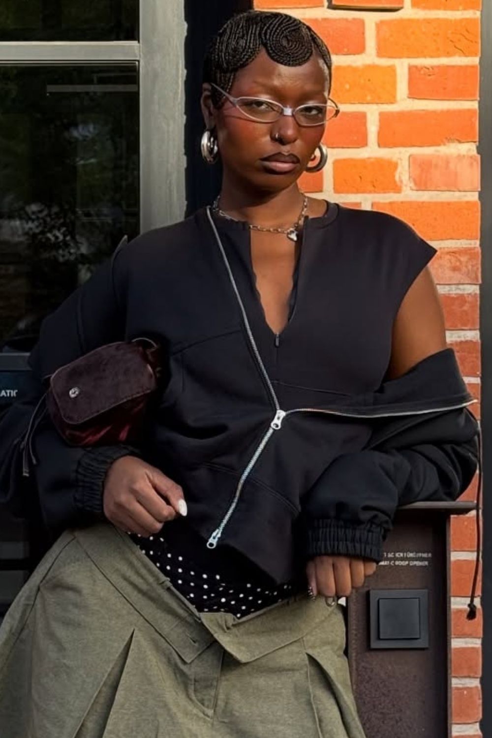 a close-up shot of a pixie haircut styled with glasses