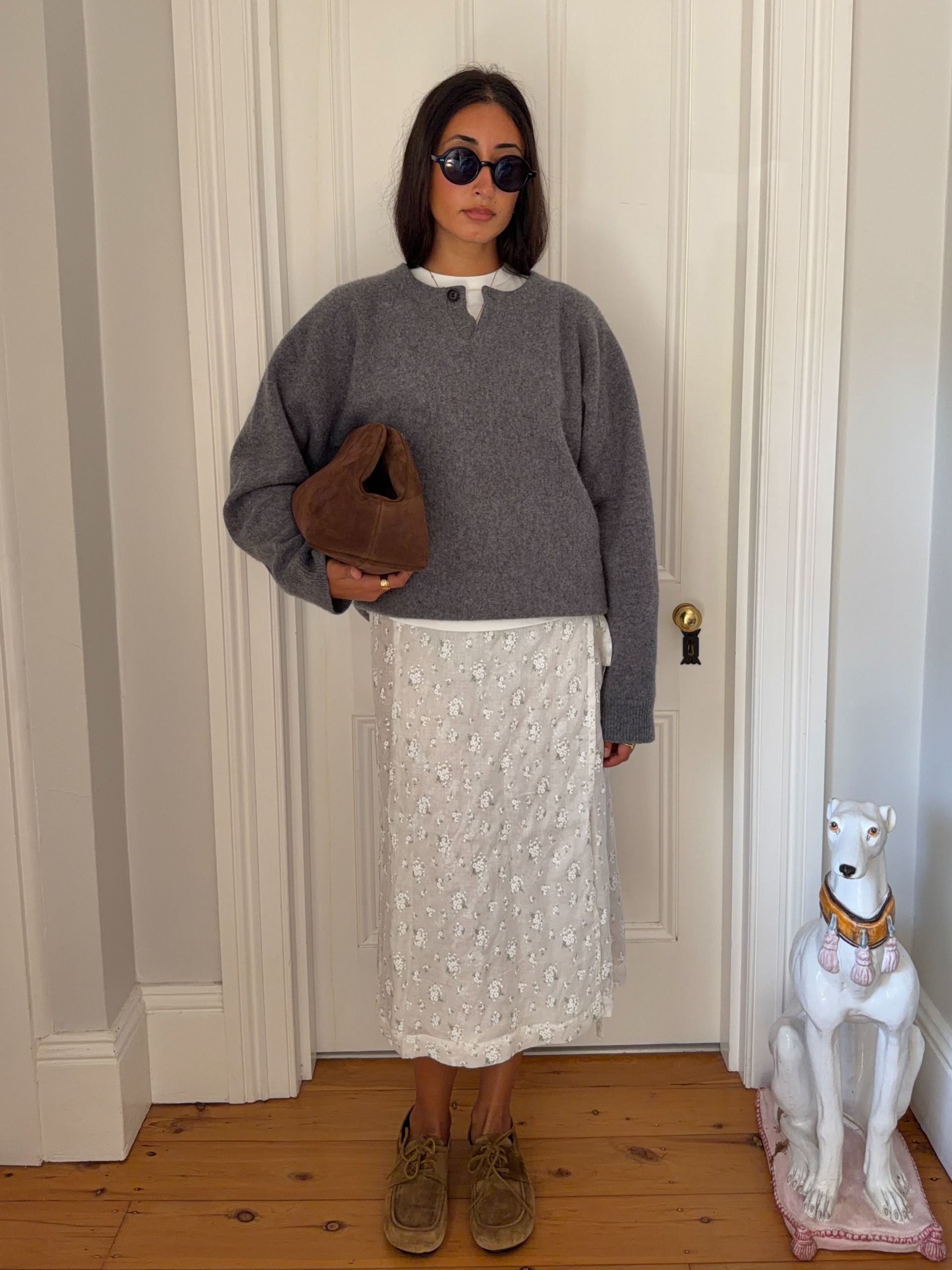 A woman wearing a fall sweater outfit in 2026.