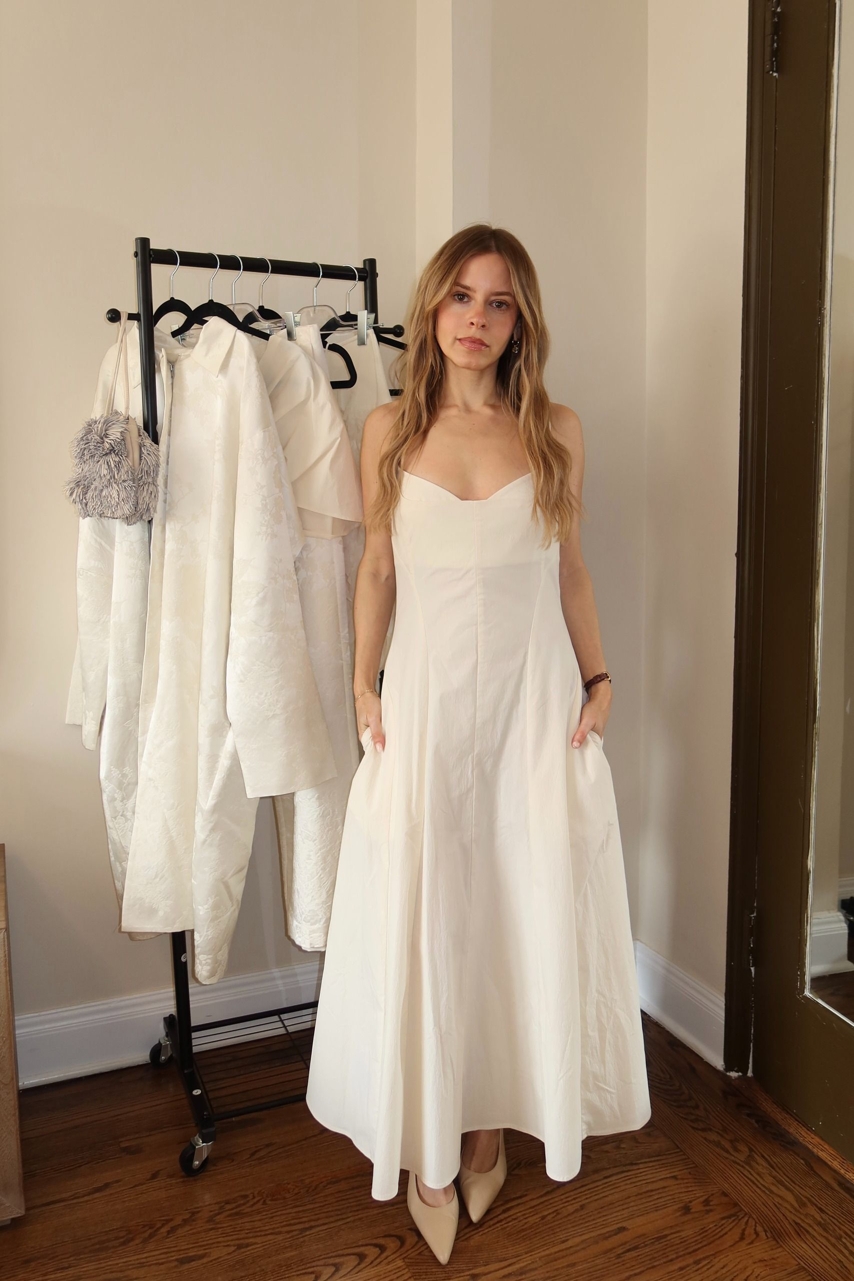 nikki tries on a dress from the st. agni bridal edit.