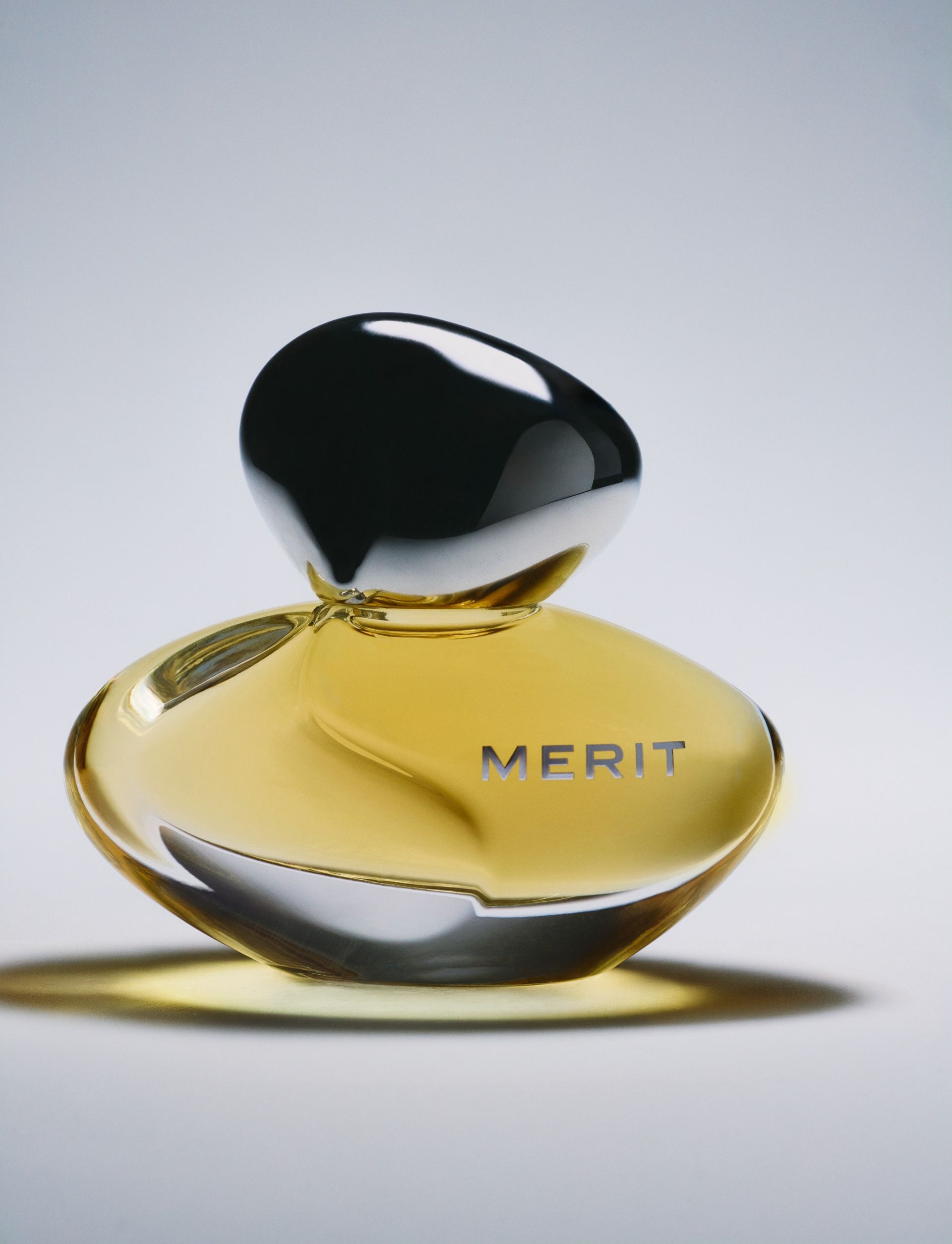 A bottle of Merit's New Wave L'Extrait de Parfum.