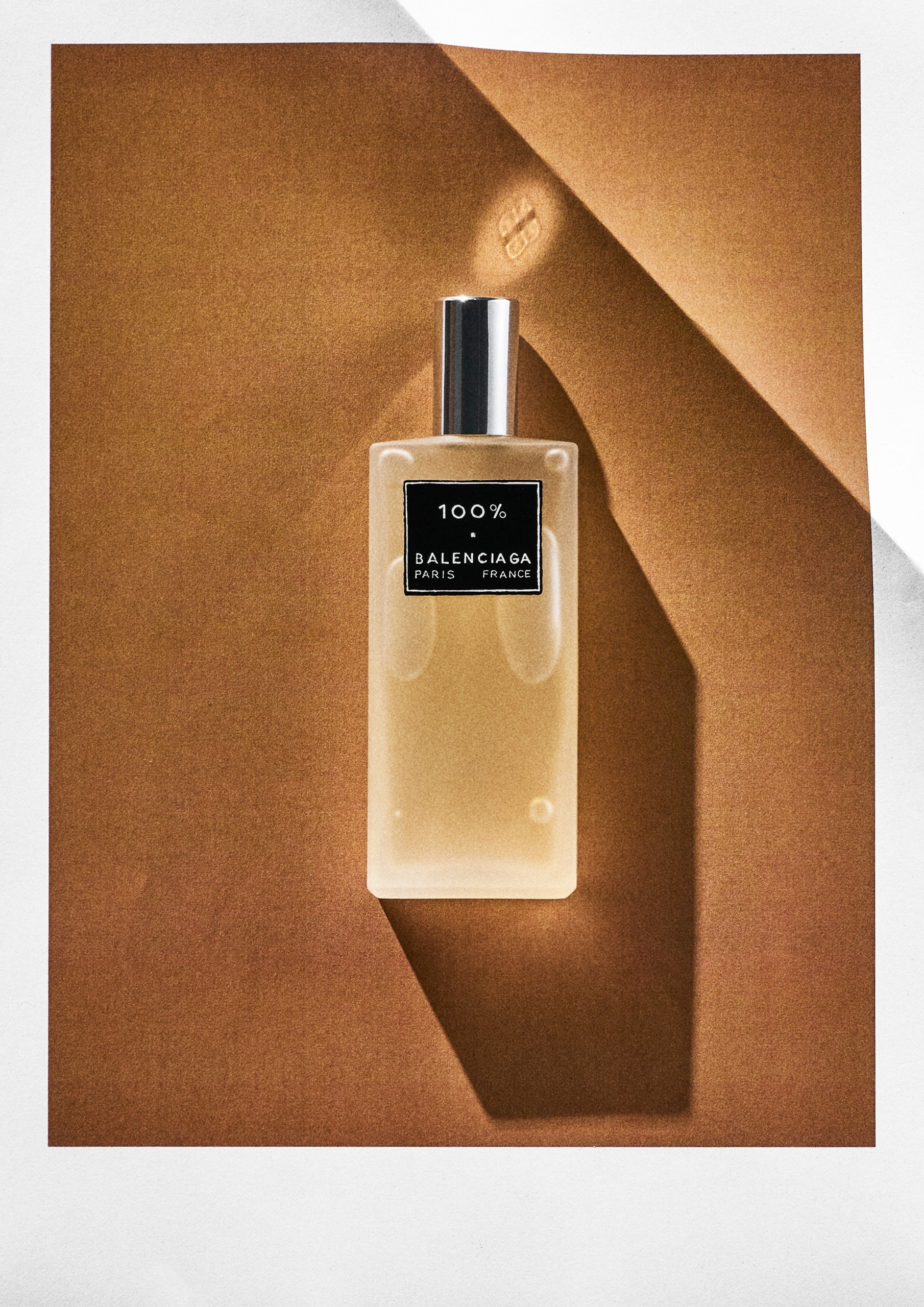 Balenciaga 100% Hair Mist on an orange background