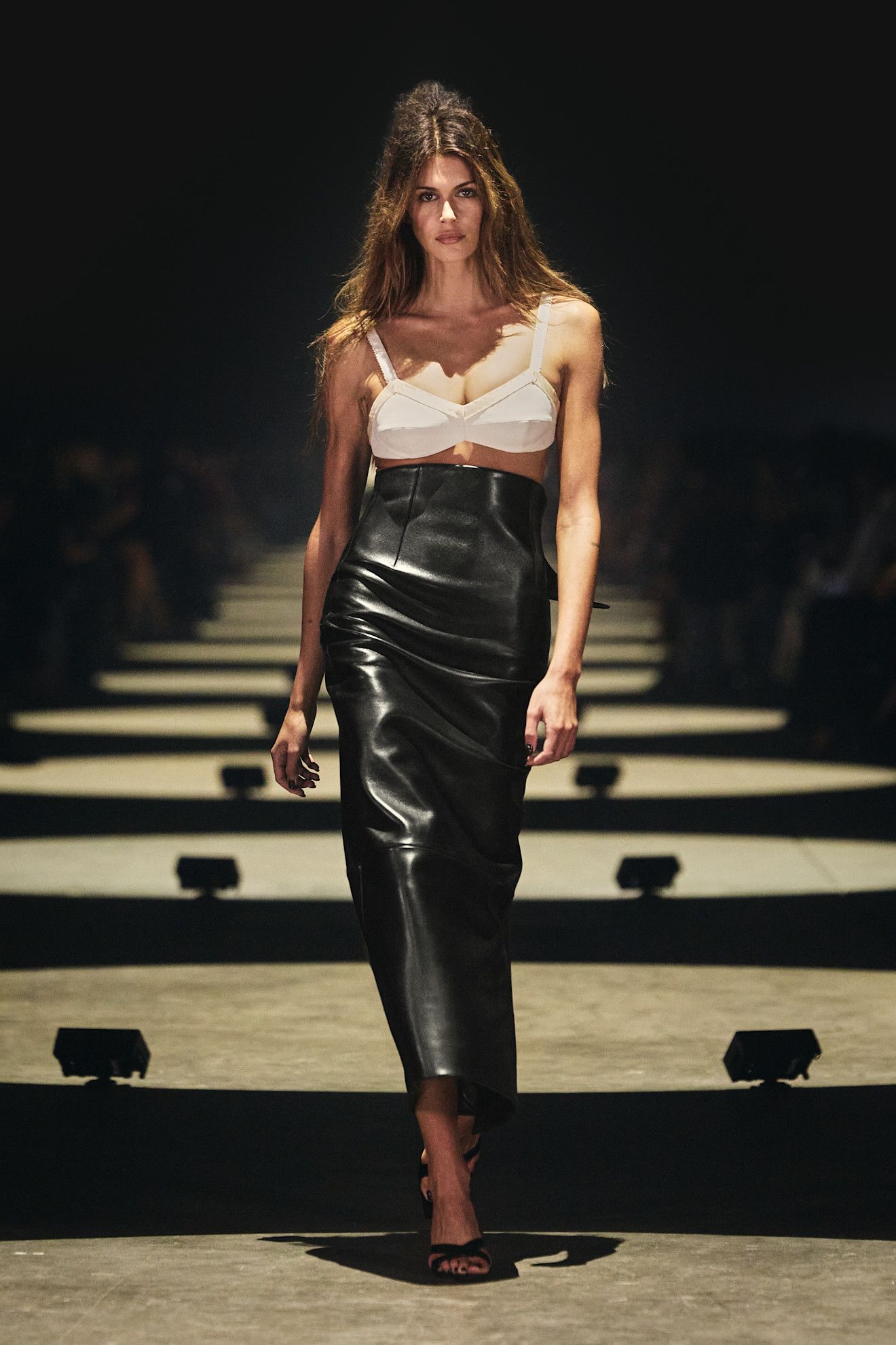 Spring/summer 2027 model wearing a bra top on the runway during fashion month.