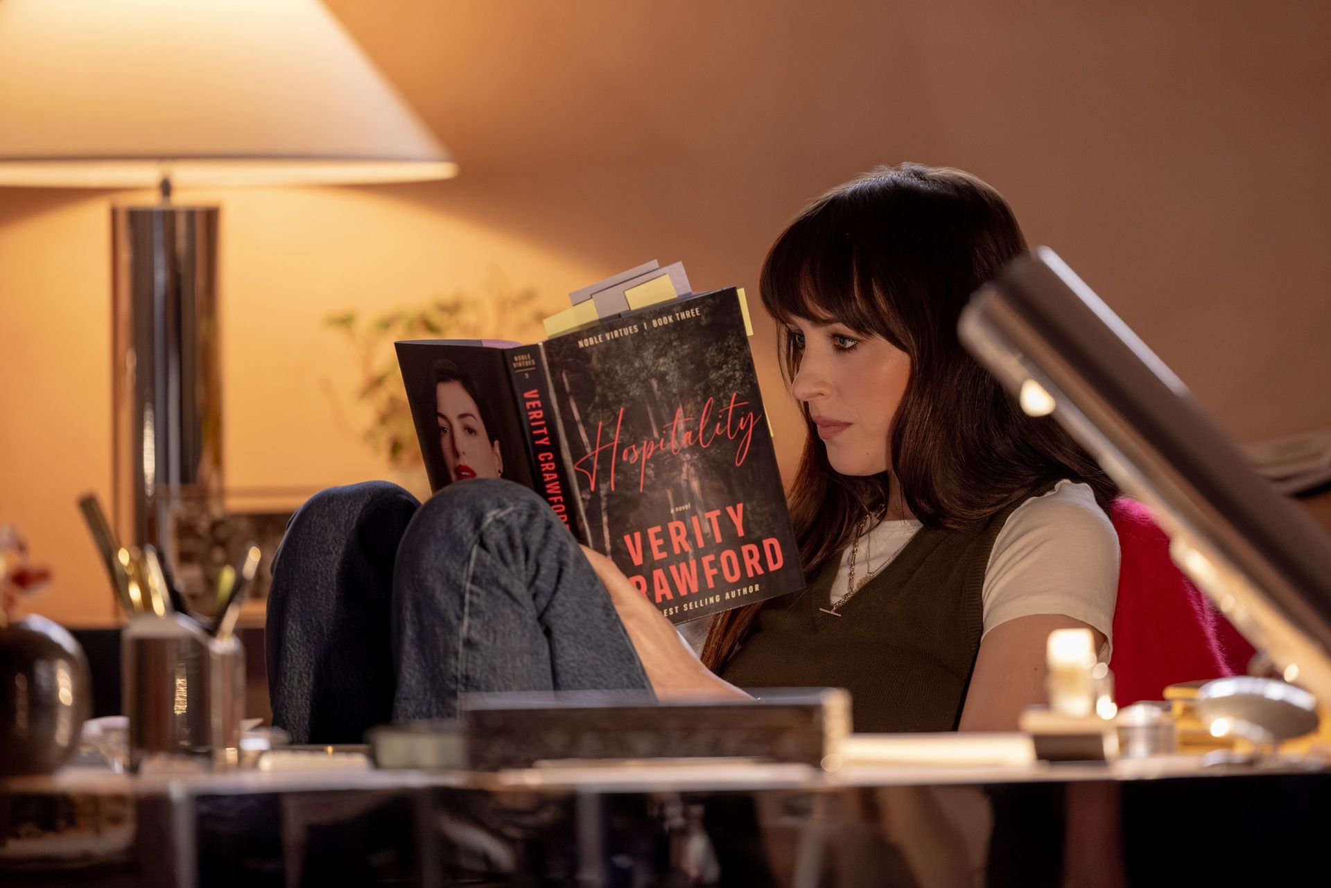 An image of Dakota Johnson wearing a V-neck sleeveless vest in the 2026 movie Verity.