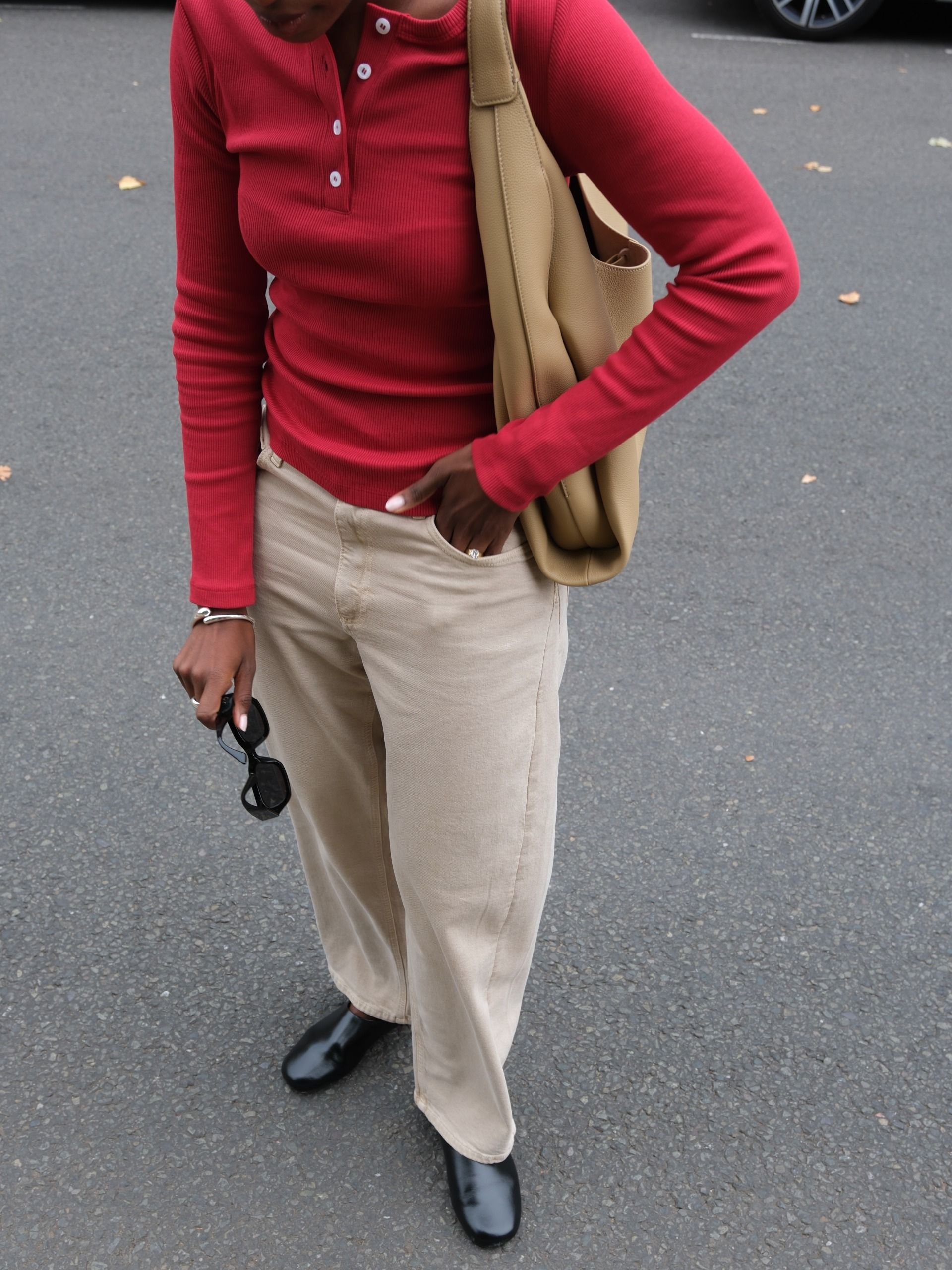 An image of a woman showcasing how to style fall basics 2026