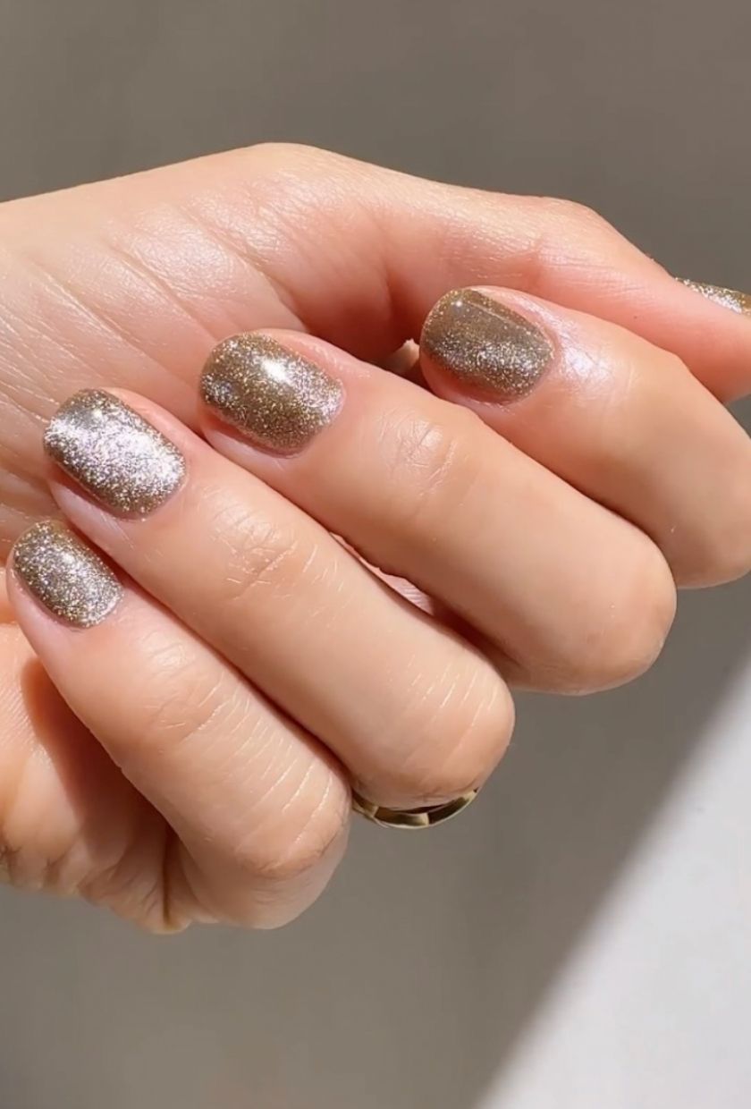 a close-up shot of gold velvet nails