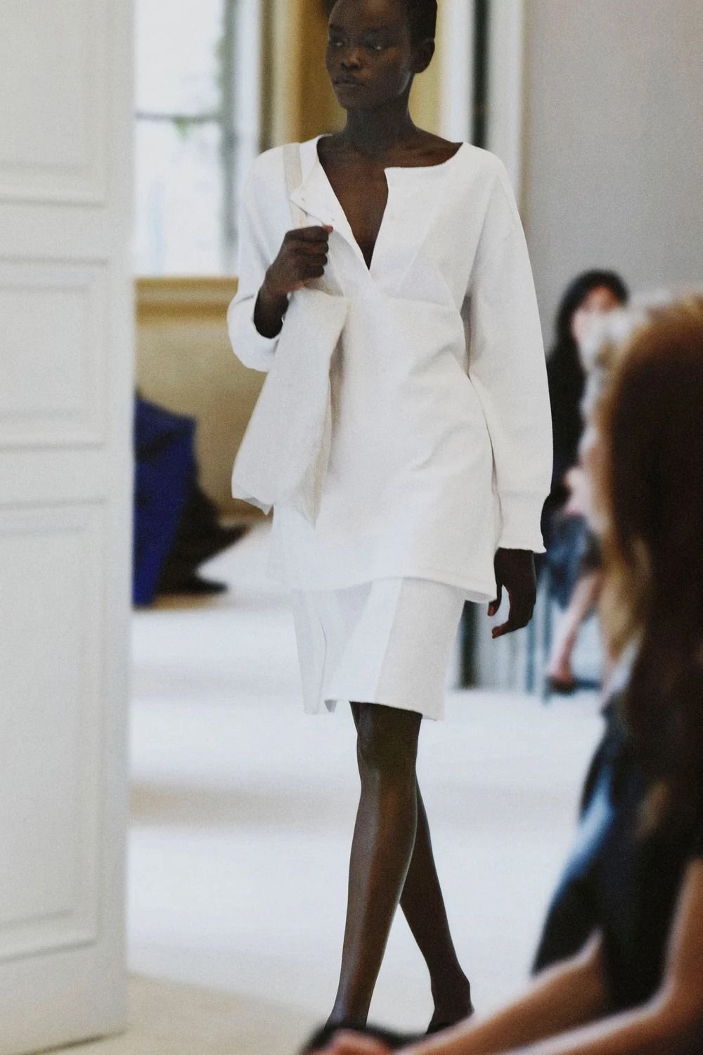 A model walking in The Row's Summer 2027 show during Paris Fashion Week.