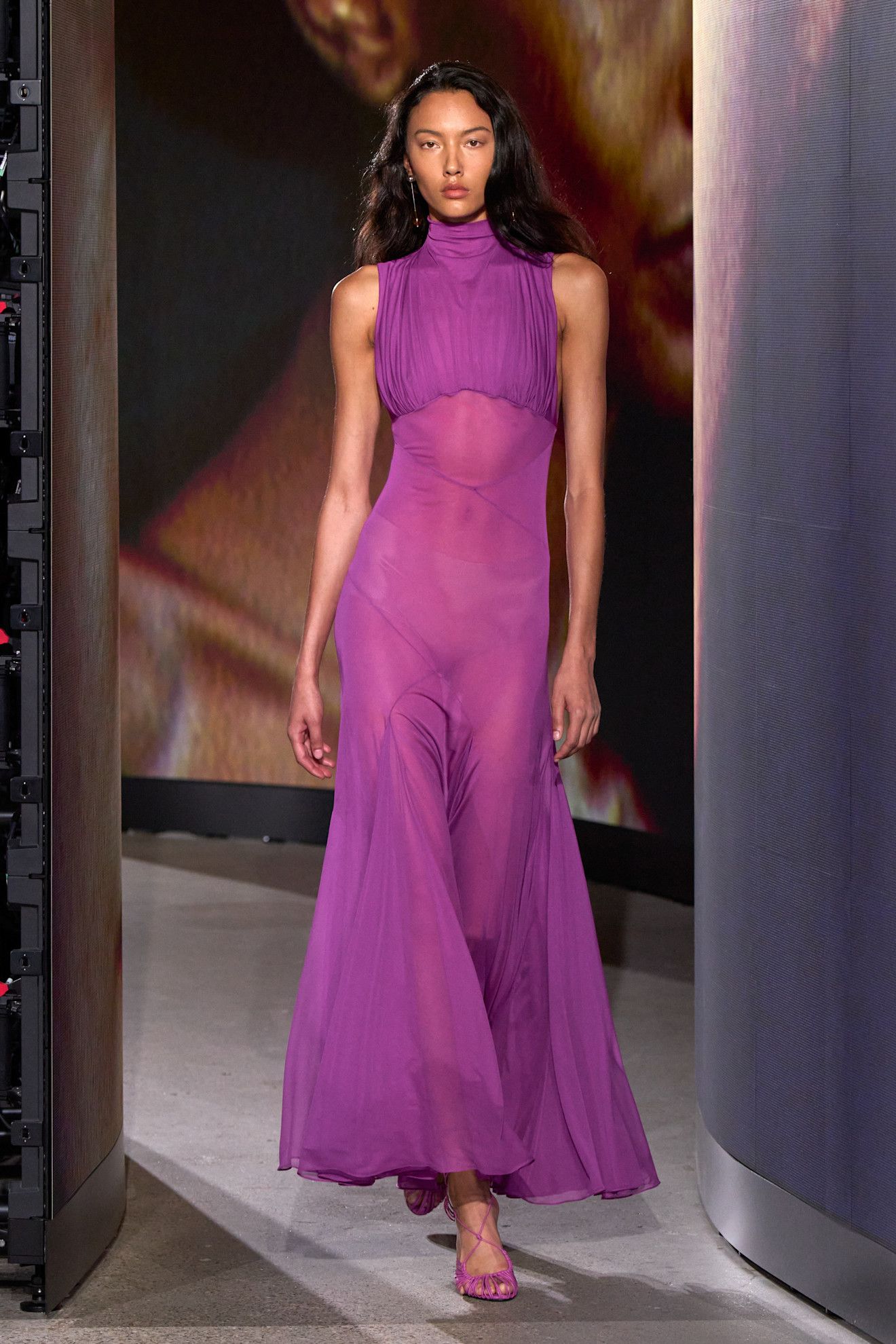 A model walking in the spring/summer 2027 Alaïa show during Paris Fashion Week wearing a jewel-tone look.