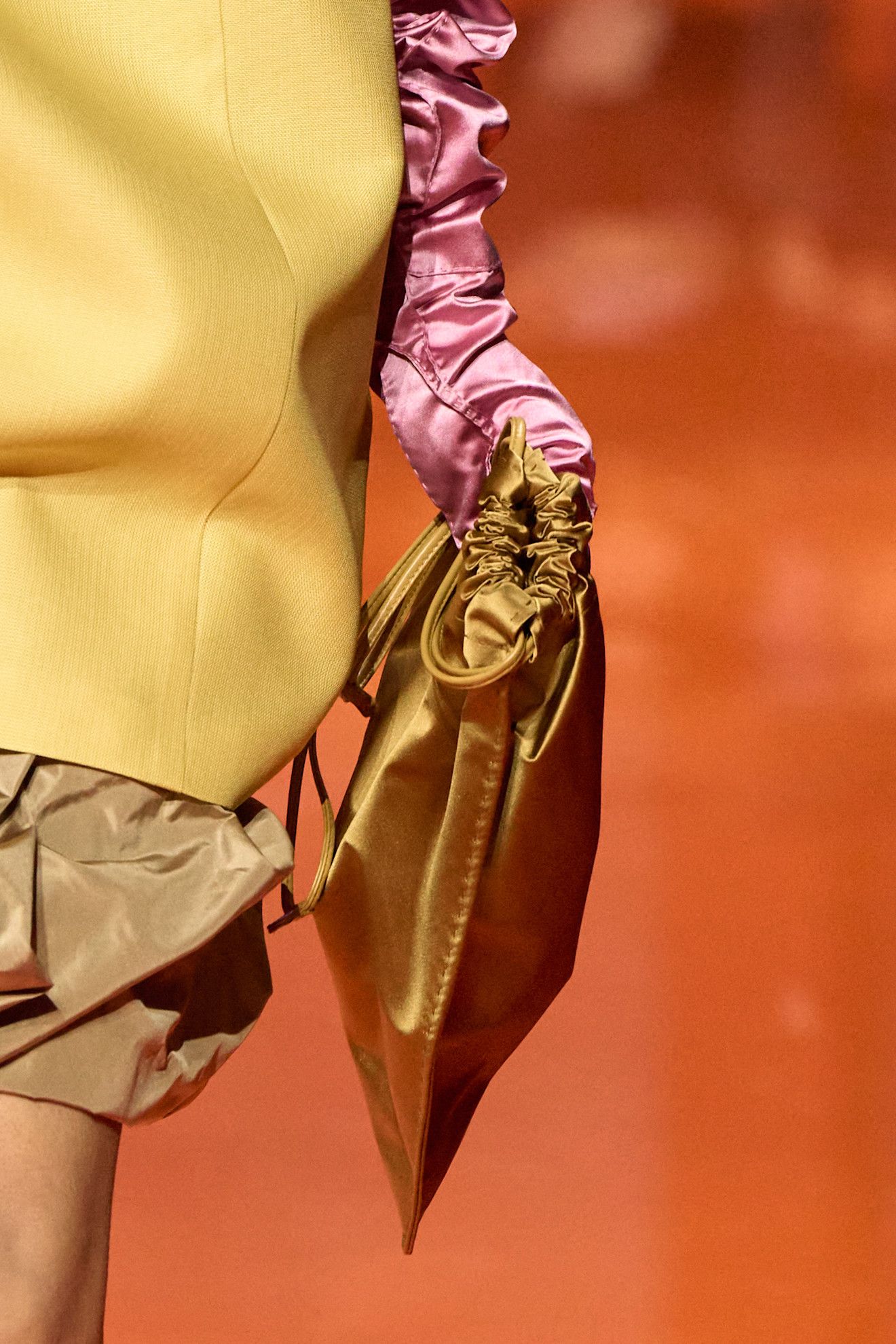 detail photo of a Prada Wish Bag on the S/S 26 runway in the shade ochre