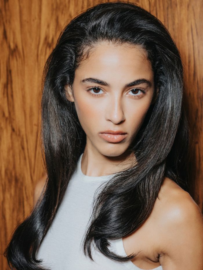 A close-up of a model backstage at the S/S 27 Connor Ives fashion show