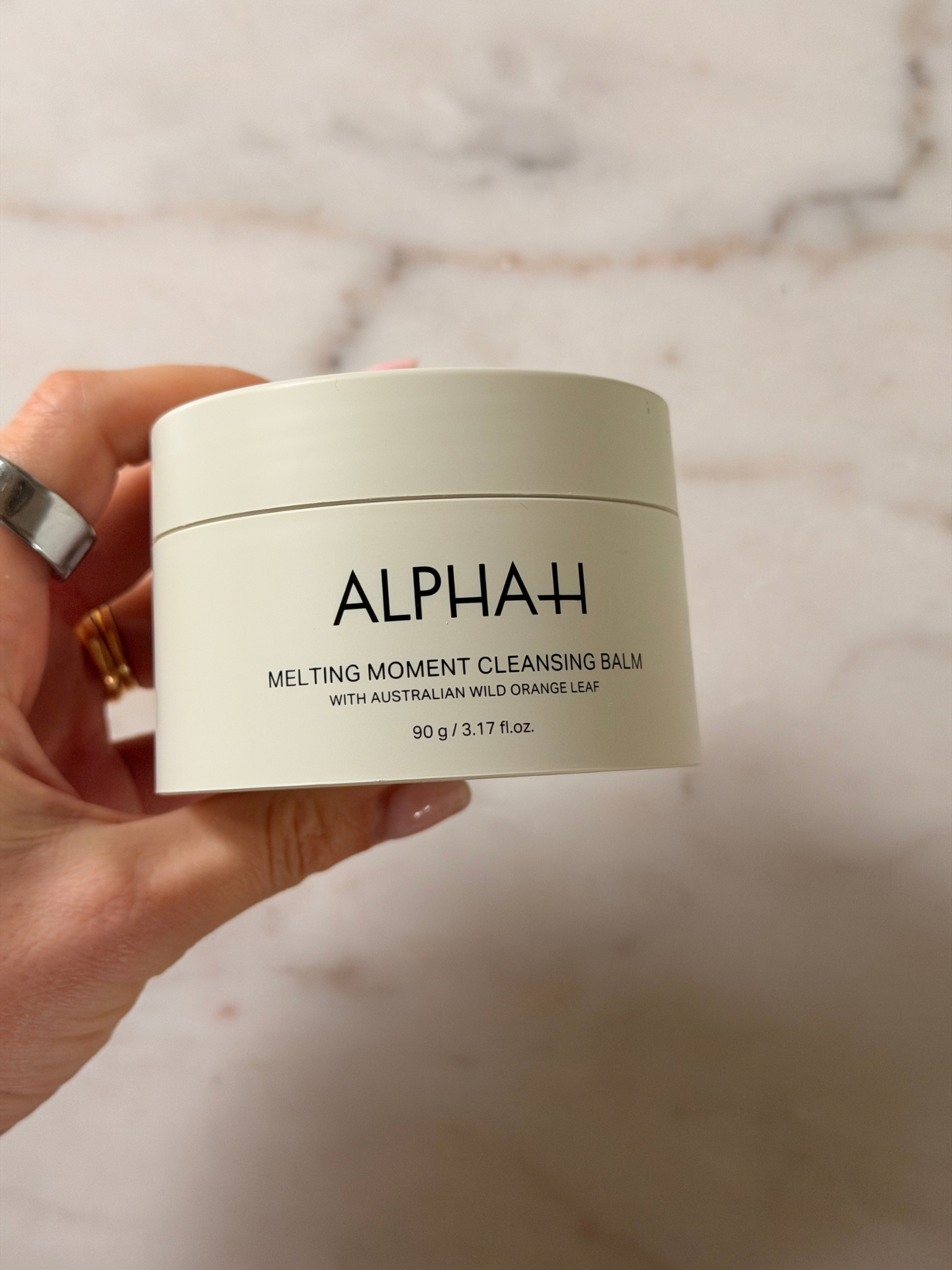 Freelance beauty editor Grace Day holding a tub of alpha H