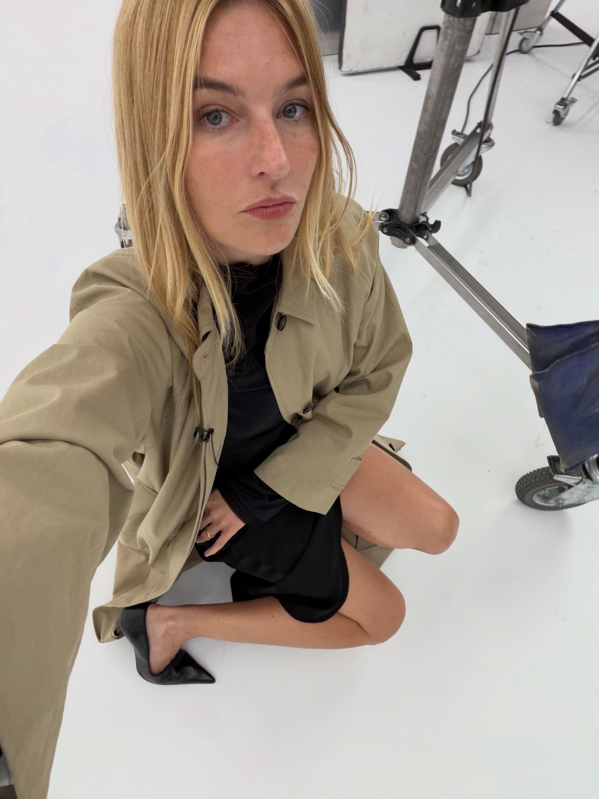 Camille Charri&egrave;re wearing a trench coat.